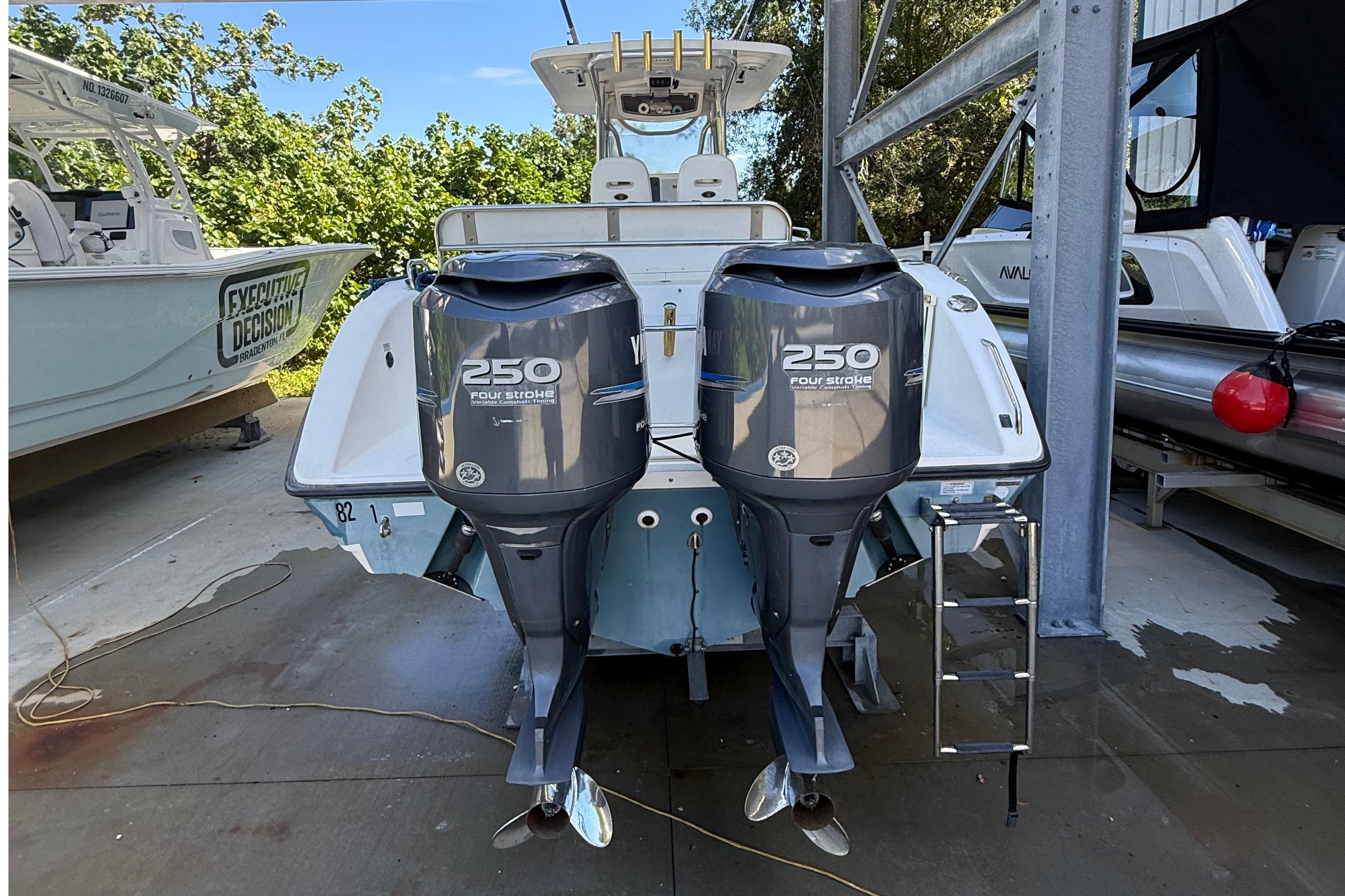 2008 Century 2901 Center Console with twin Yamaha 250 four-stroke engines in a marina.