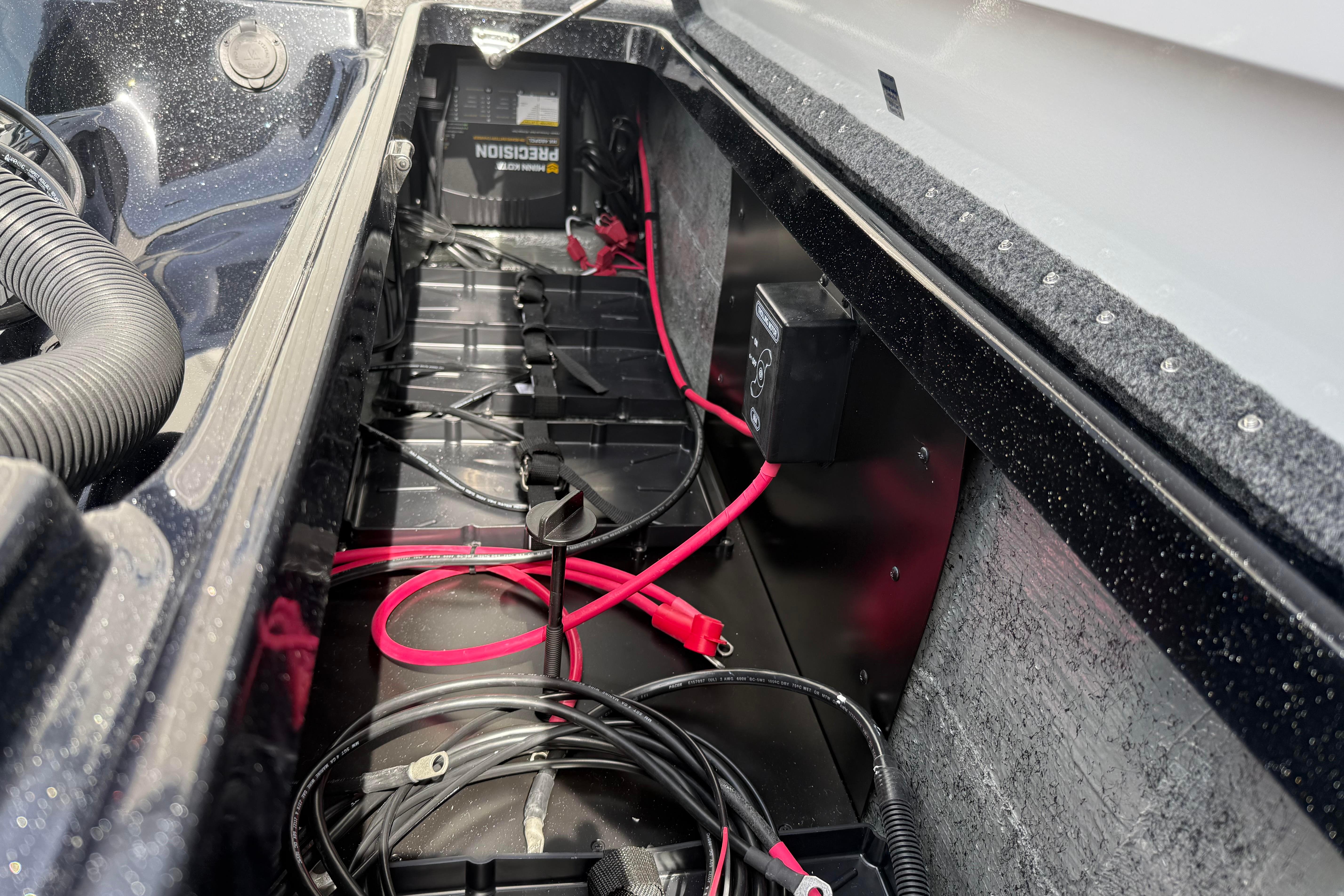 Battery compartment of 2027 Phoenix 921 Elite X with wiring and components.