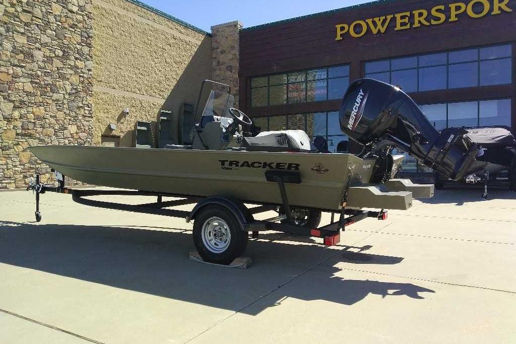 2026 Tracker Grizzly 1860 CC boat on trailer outside Powersport store.