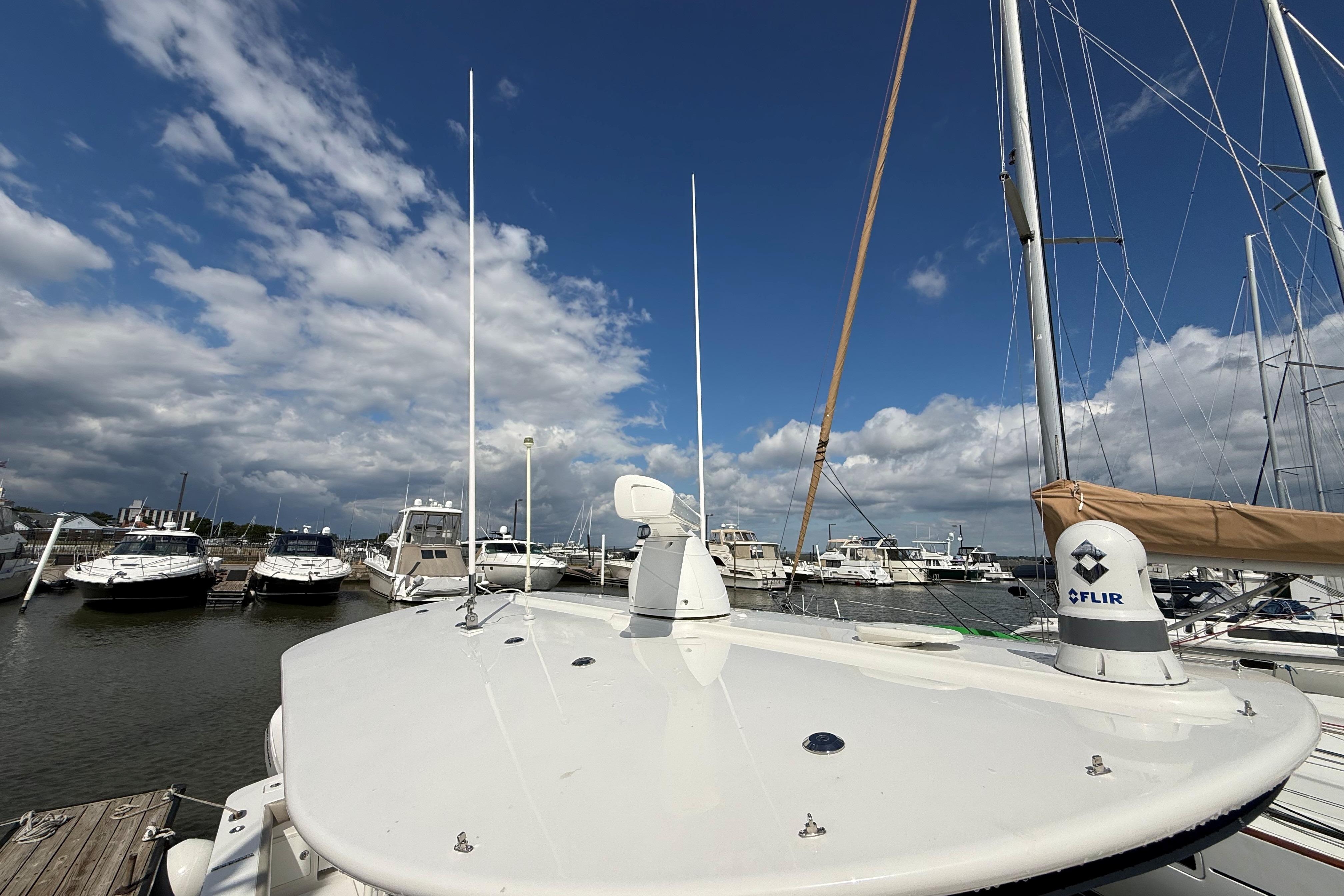 2019 Regulator 34SS boat docked at marina under blue sky.