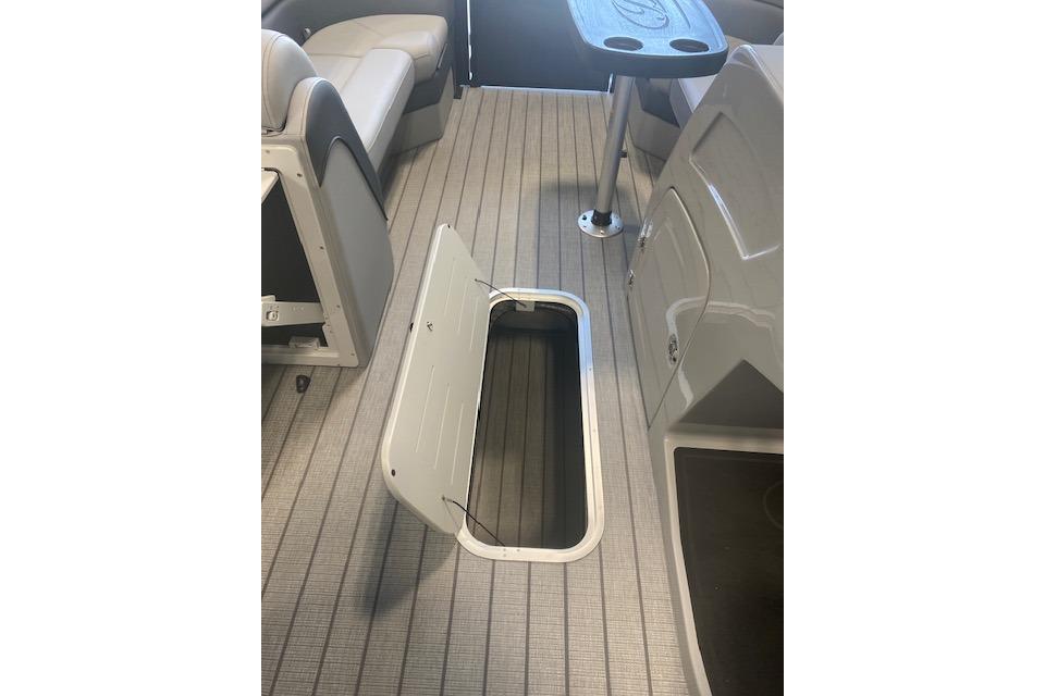 2026 Bentley Pontoons Elite 223 Swingback interior with open storage compartment and seating.