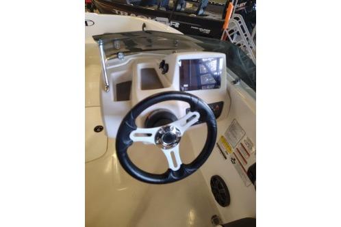 2026 Tahoe T16 boat dashboard with steering wheel and control panel.