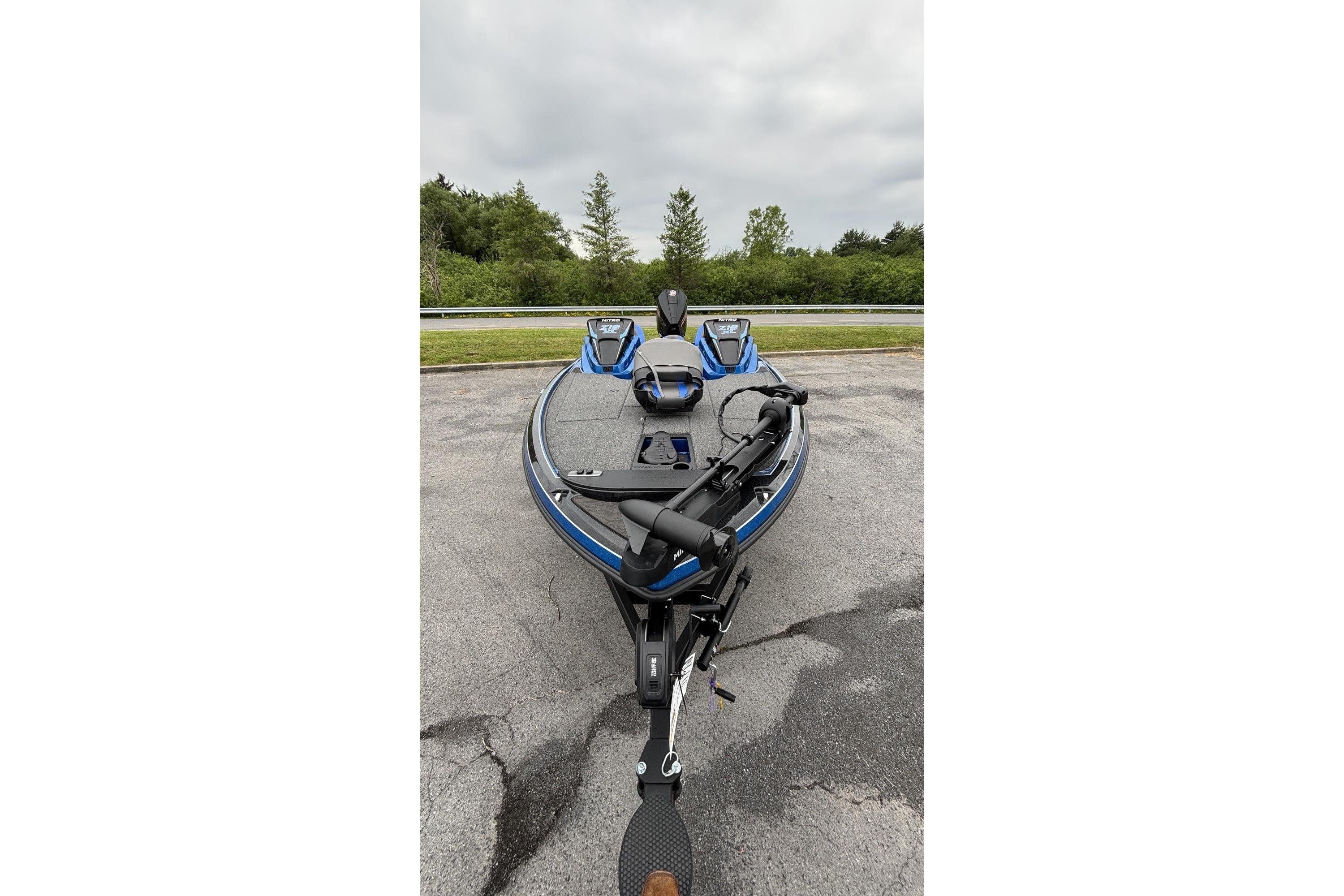 2026 Nitro Z19 XL boat on pavement, featuring sleek design and modern equipment.