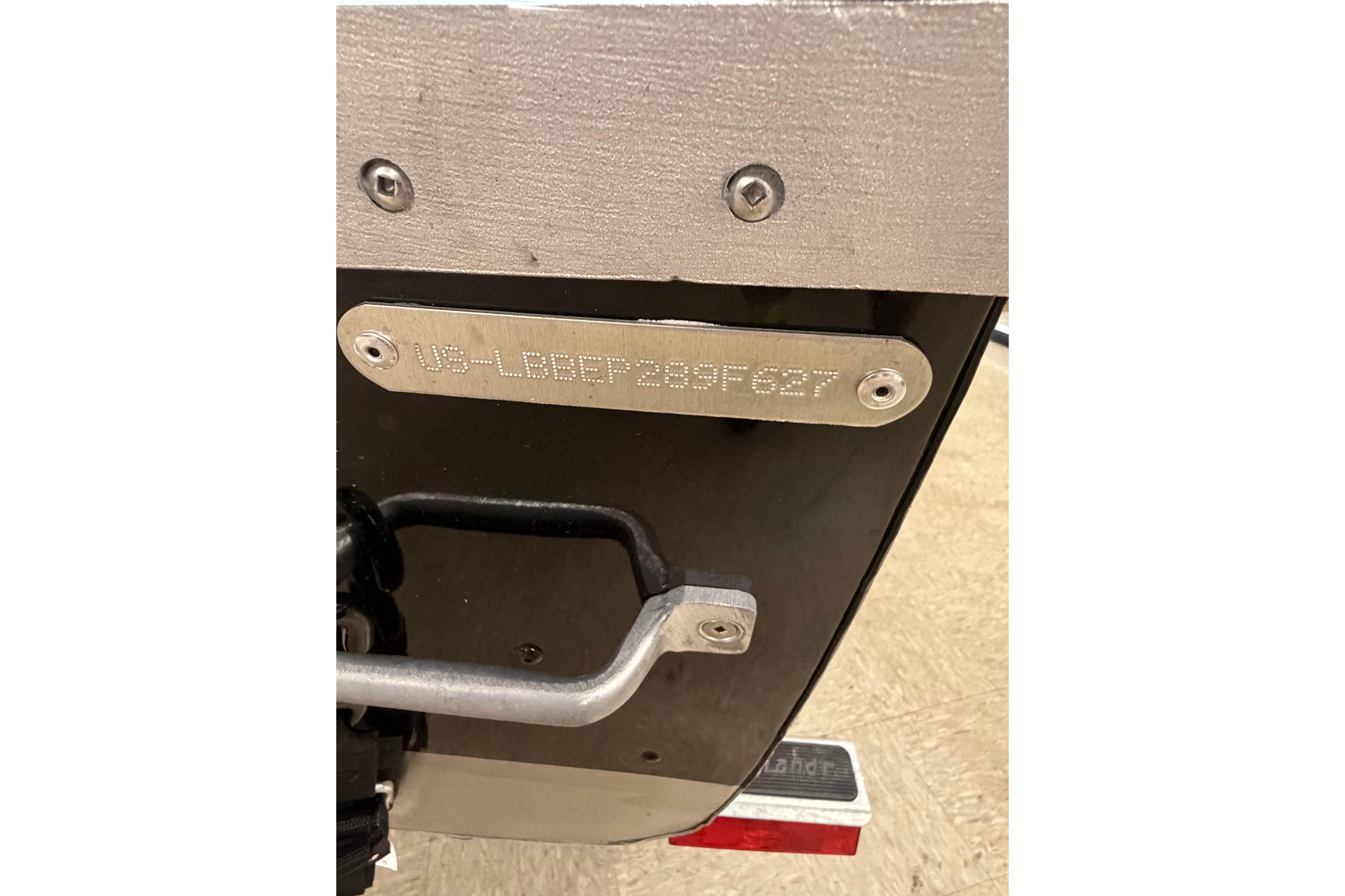 2027 Lund WC 16 boat transom with identification plate and hardware.
