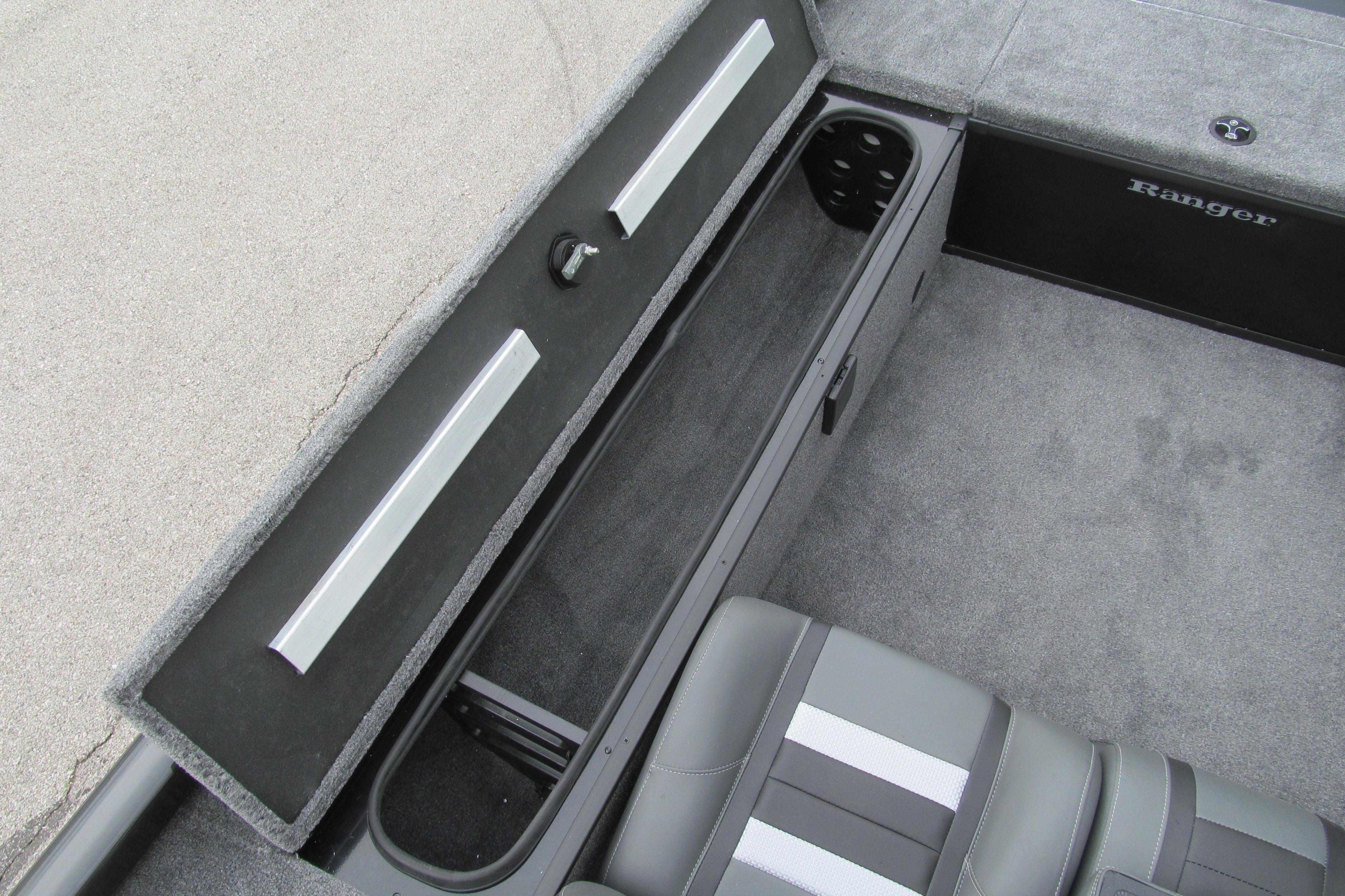 2026 Ranger RT188C boat interior storage compartment with gray carpet and seating.
