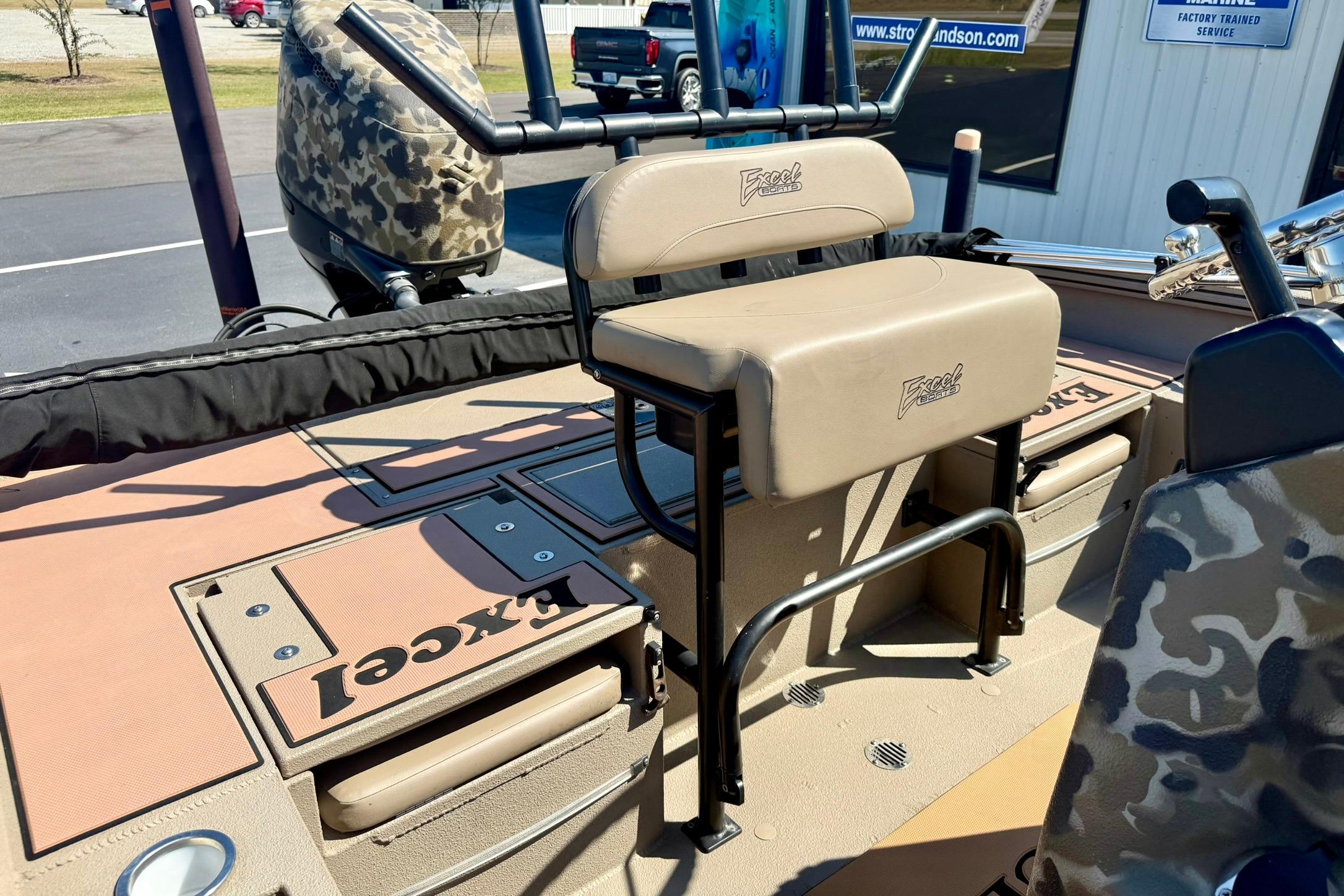 2019 Excel 230 Bay Pro boat interior with seating and storage compartments.