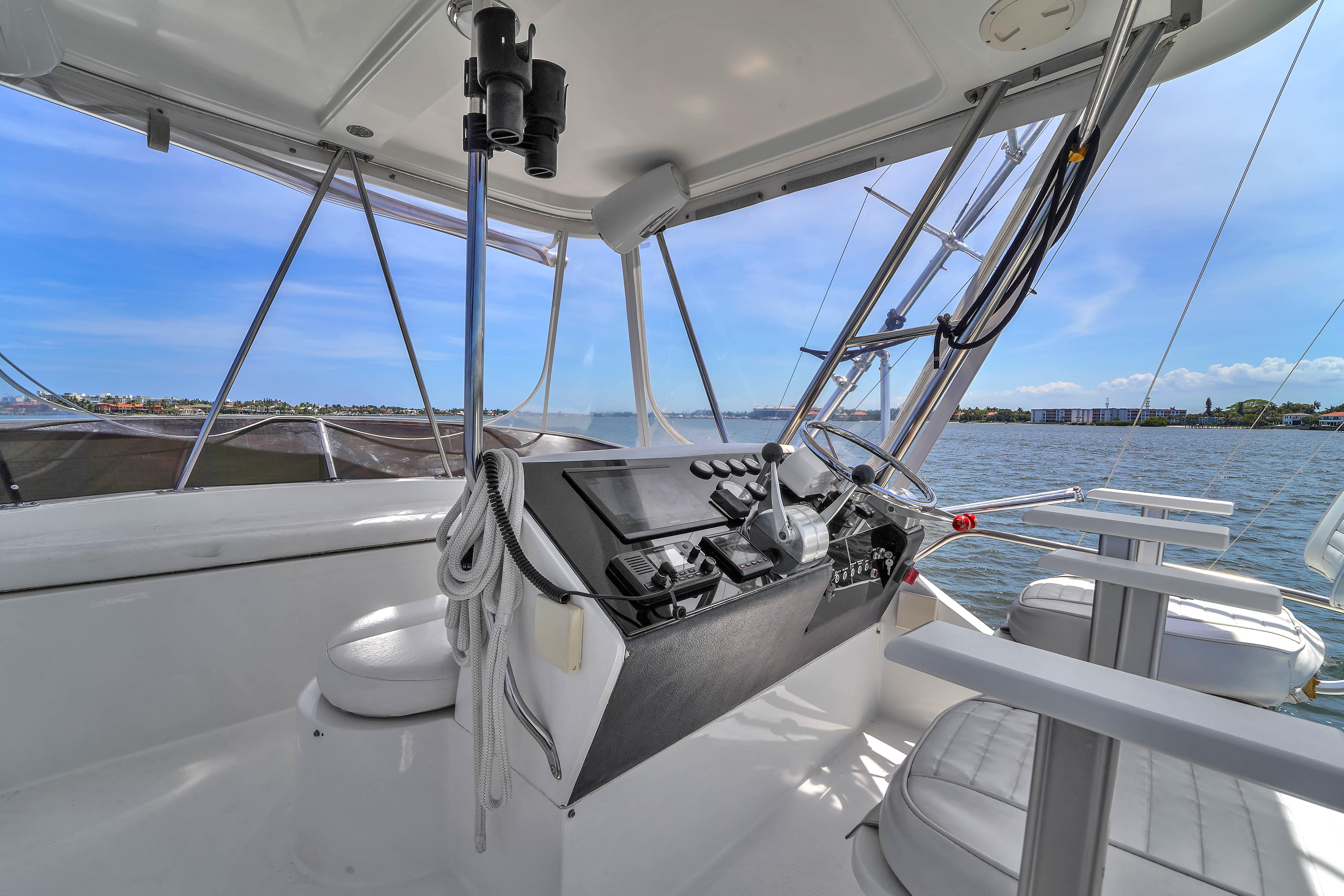 2001 Mediterranean 38 Convertible yacht helm with ocean view and modern controls.