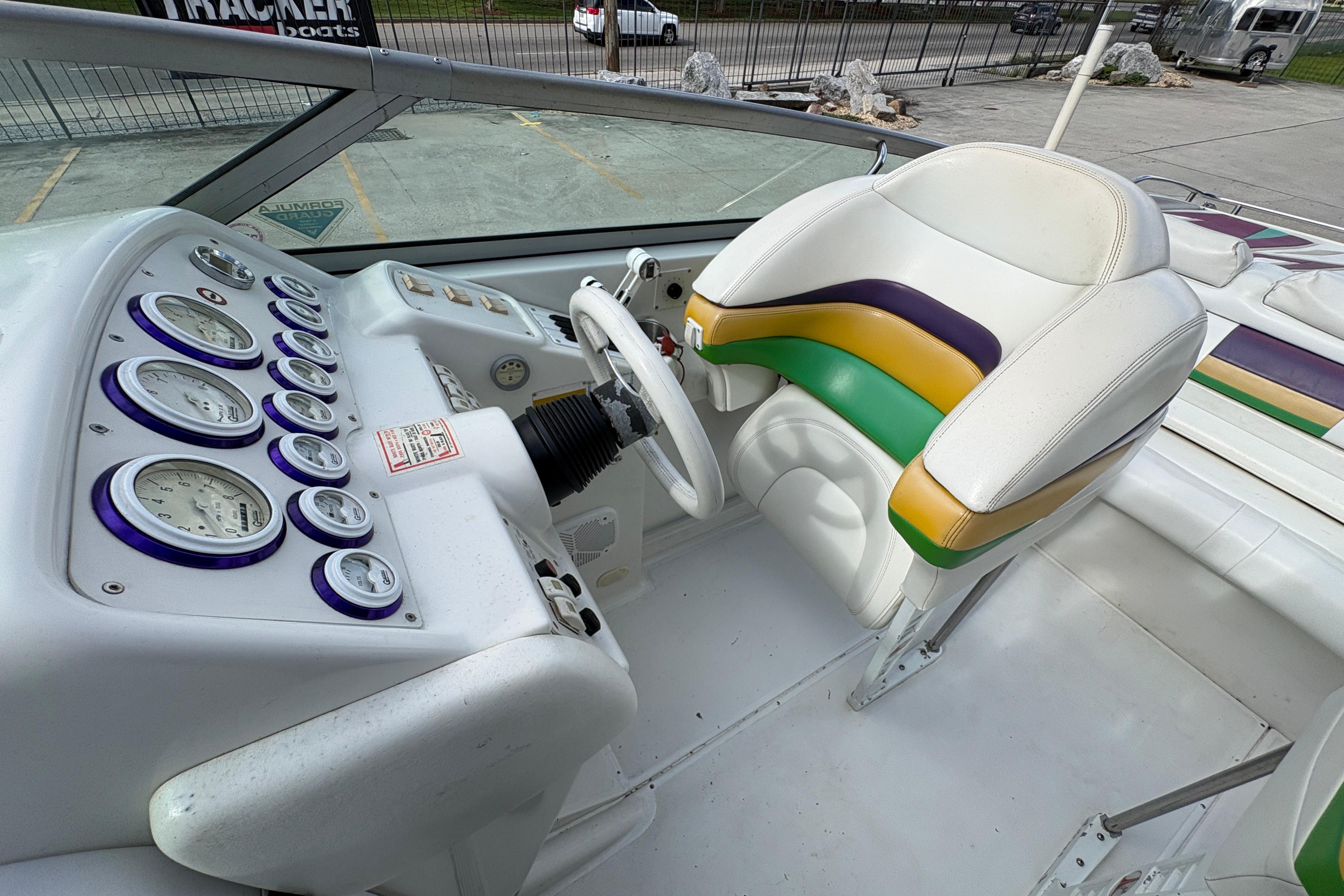 2002 Formula 292 FASTech boat cockpit with colorful seat and detailed instrument panel.