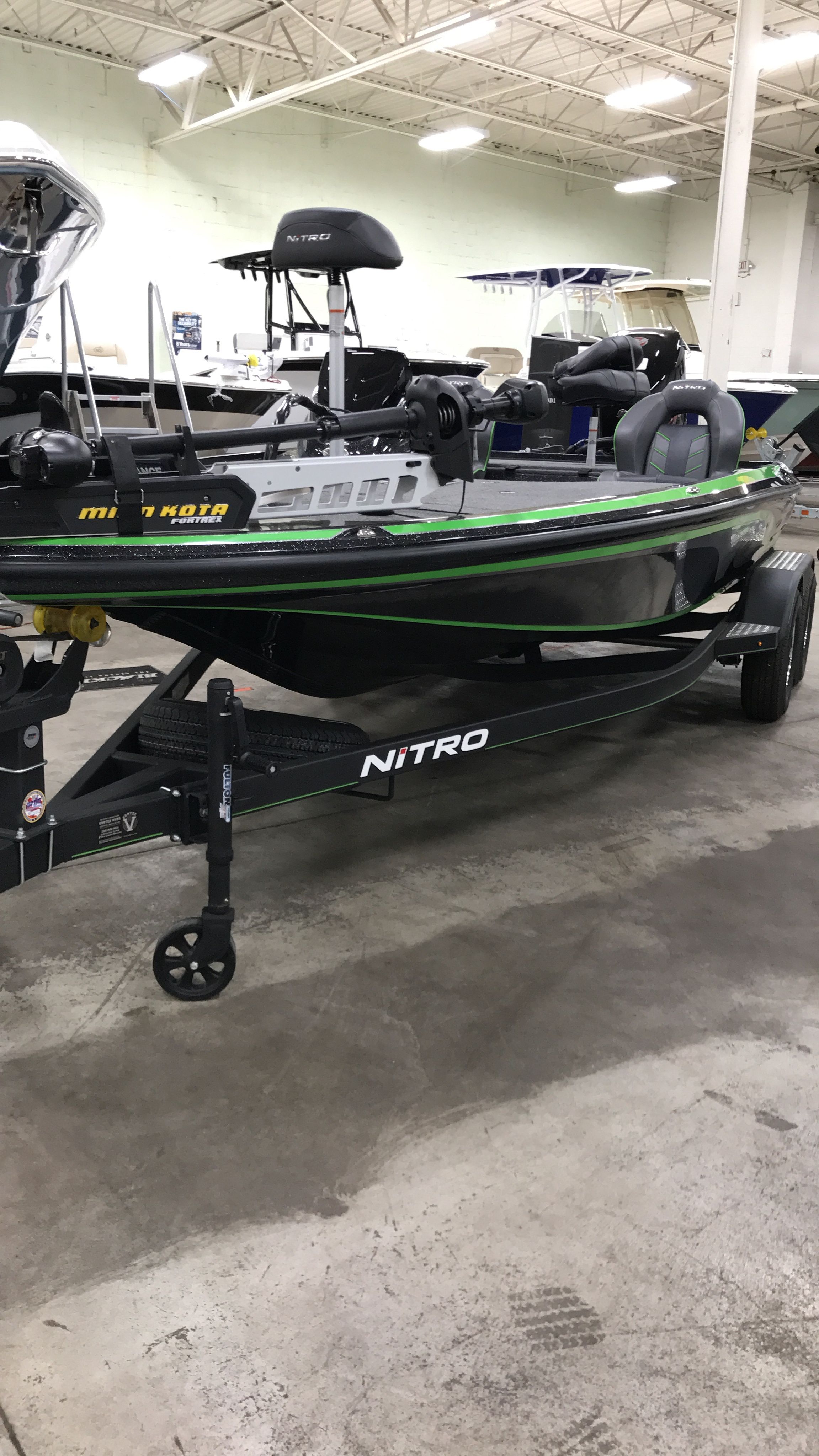 2018 Nitro Z19 Pro boat in a warehouse.