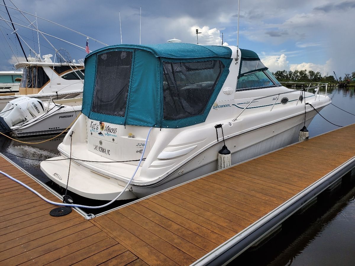 1995 Sea Ray Sundancer 330 docked at a marina.