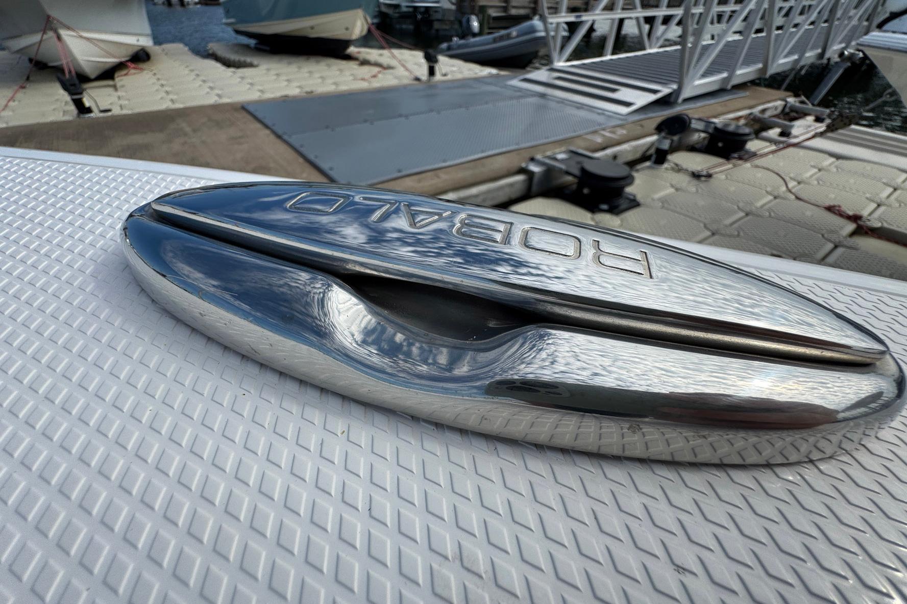 Chrome detail on 2021 Robalo 246 Cayman boat at dockside.