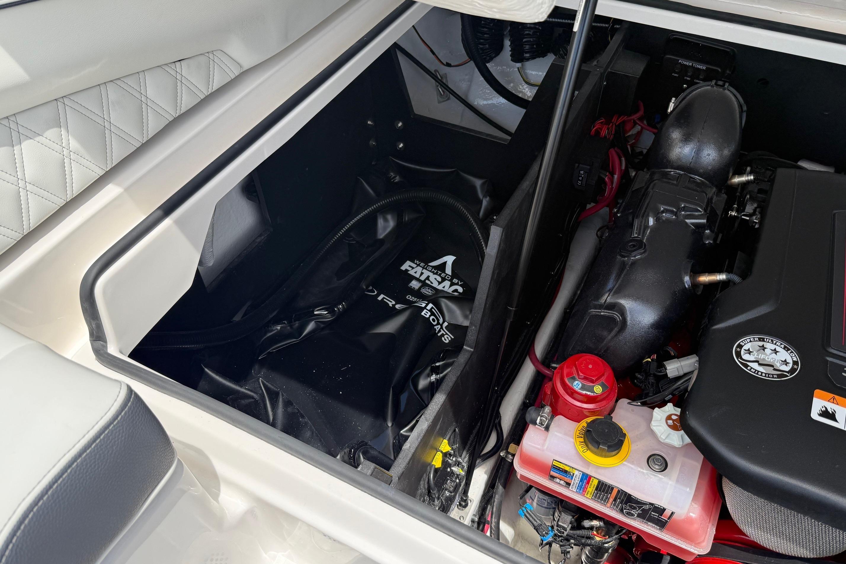 Engine compartment of 2026 Regal LS4 Surf boat, featuring ballast system and engine components.