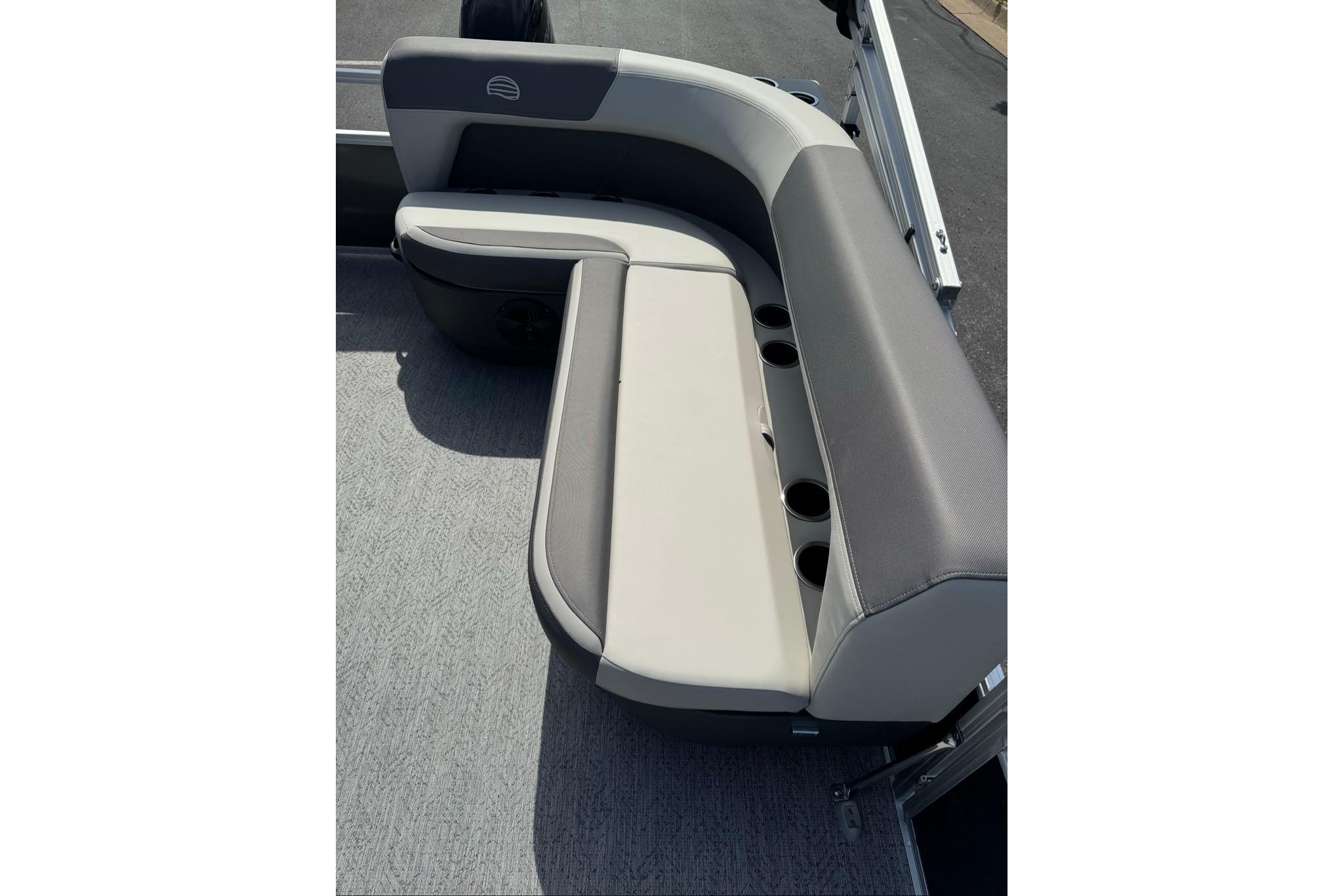 2026 Sun Tracker Bass Buggy 16 XL Select boat seating with cup holders, gray and beige upholstery.