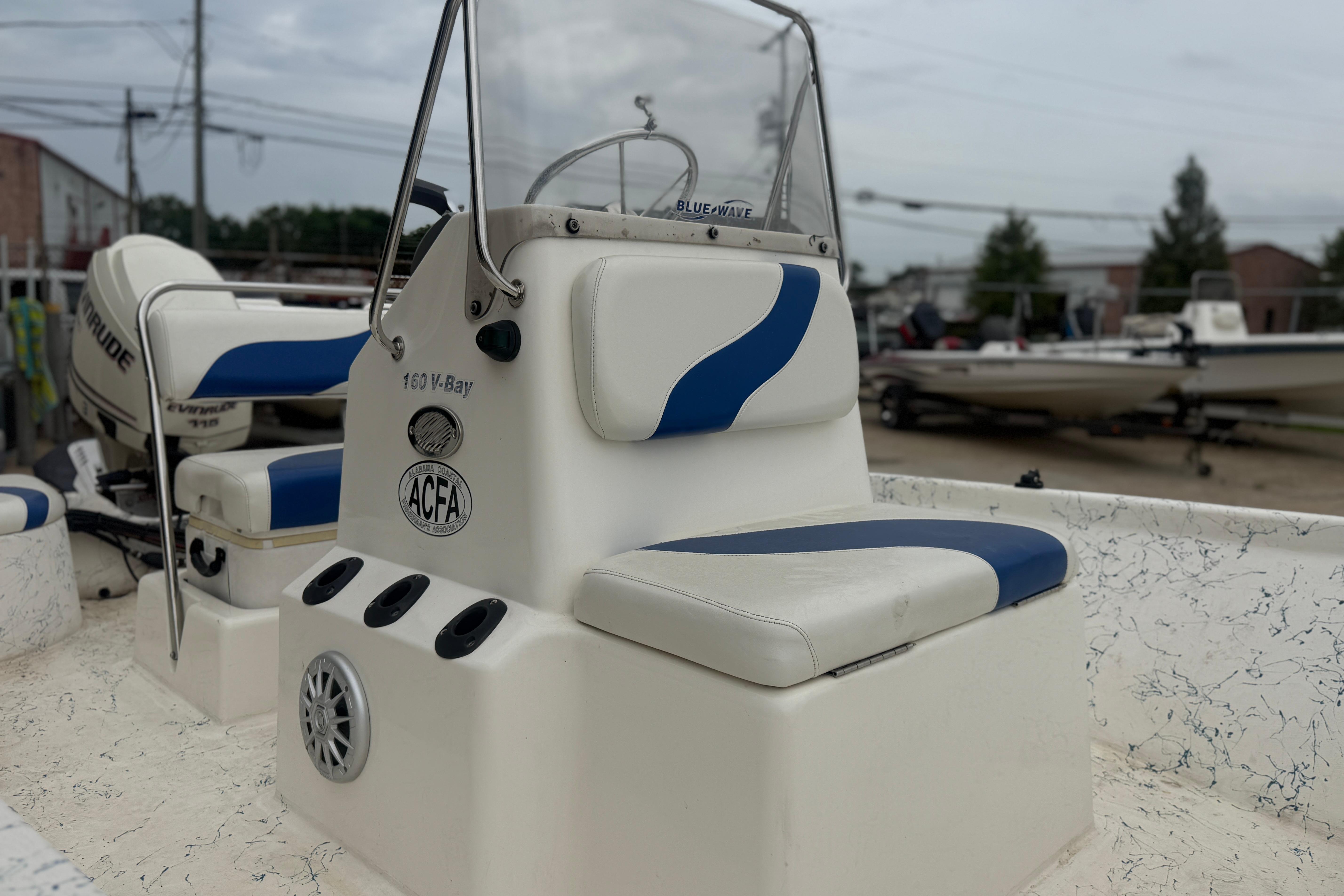 2004 Blue Wave 160 V-Bay boat interior with blue and white seating.