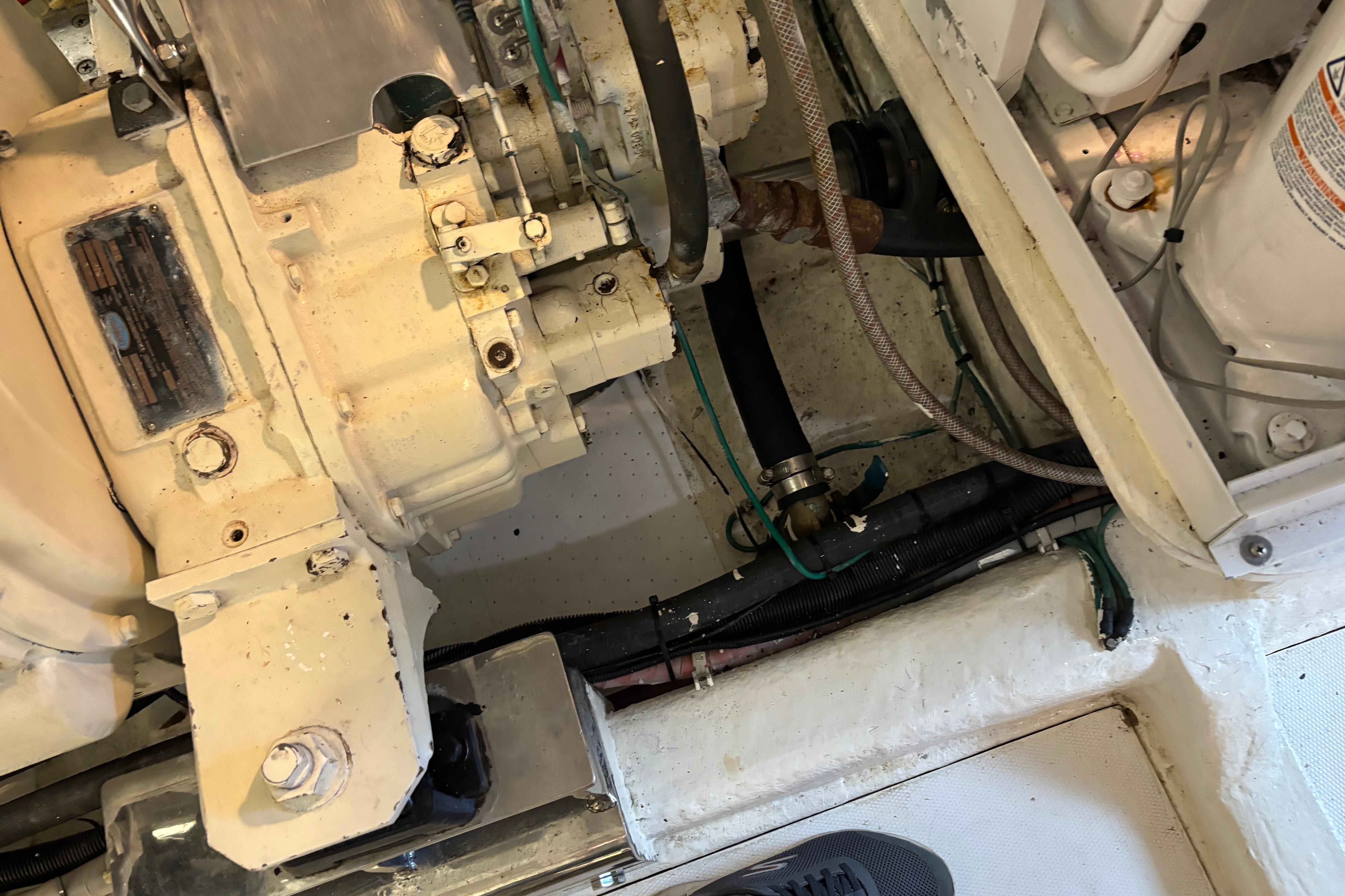 Engine compartment of a 2004 Hampton F/B Cruiser, showcasing mechanical components and hoses.