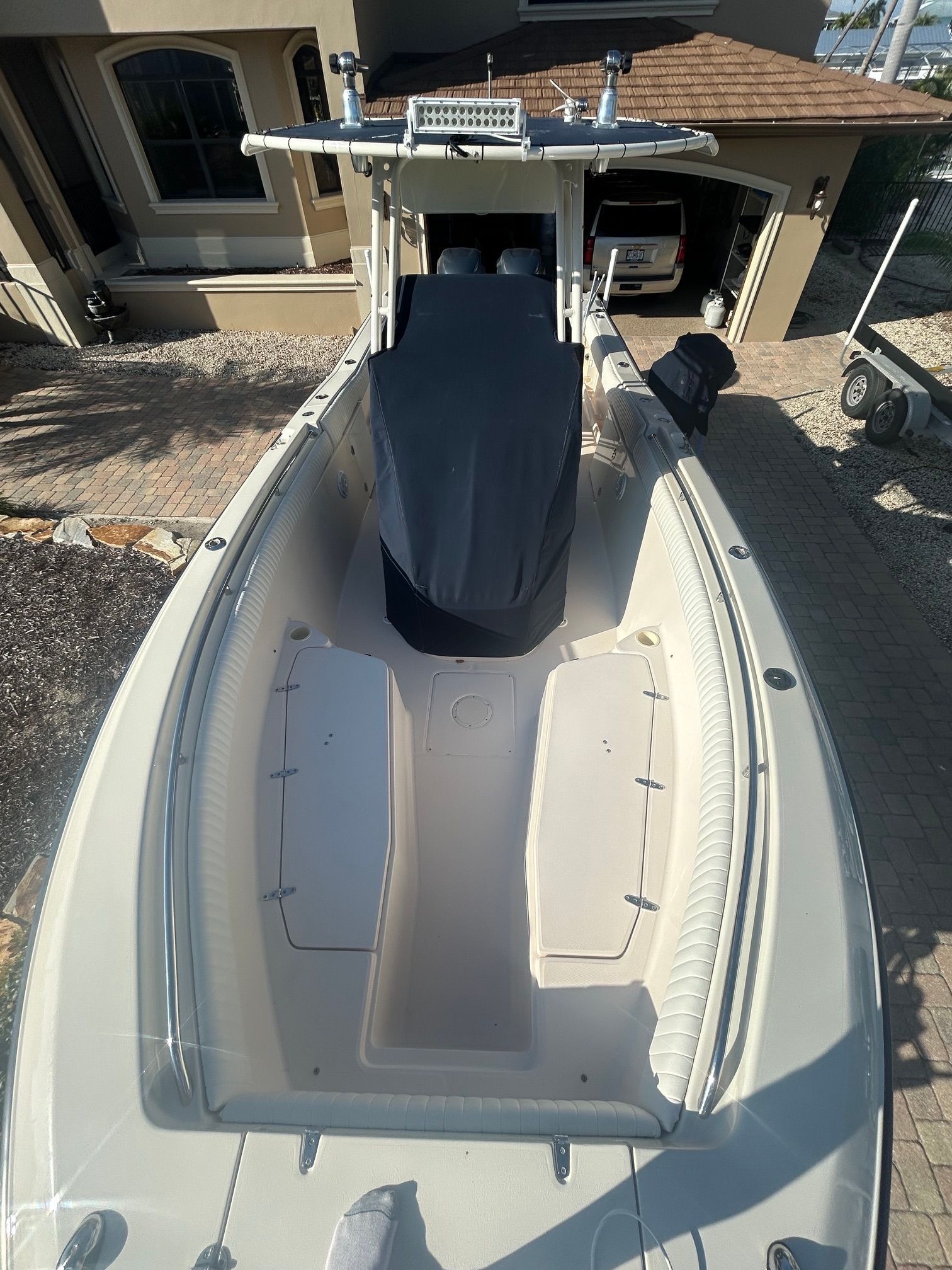 2006 Grady-White Chase 273 boat parked in a driveway.