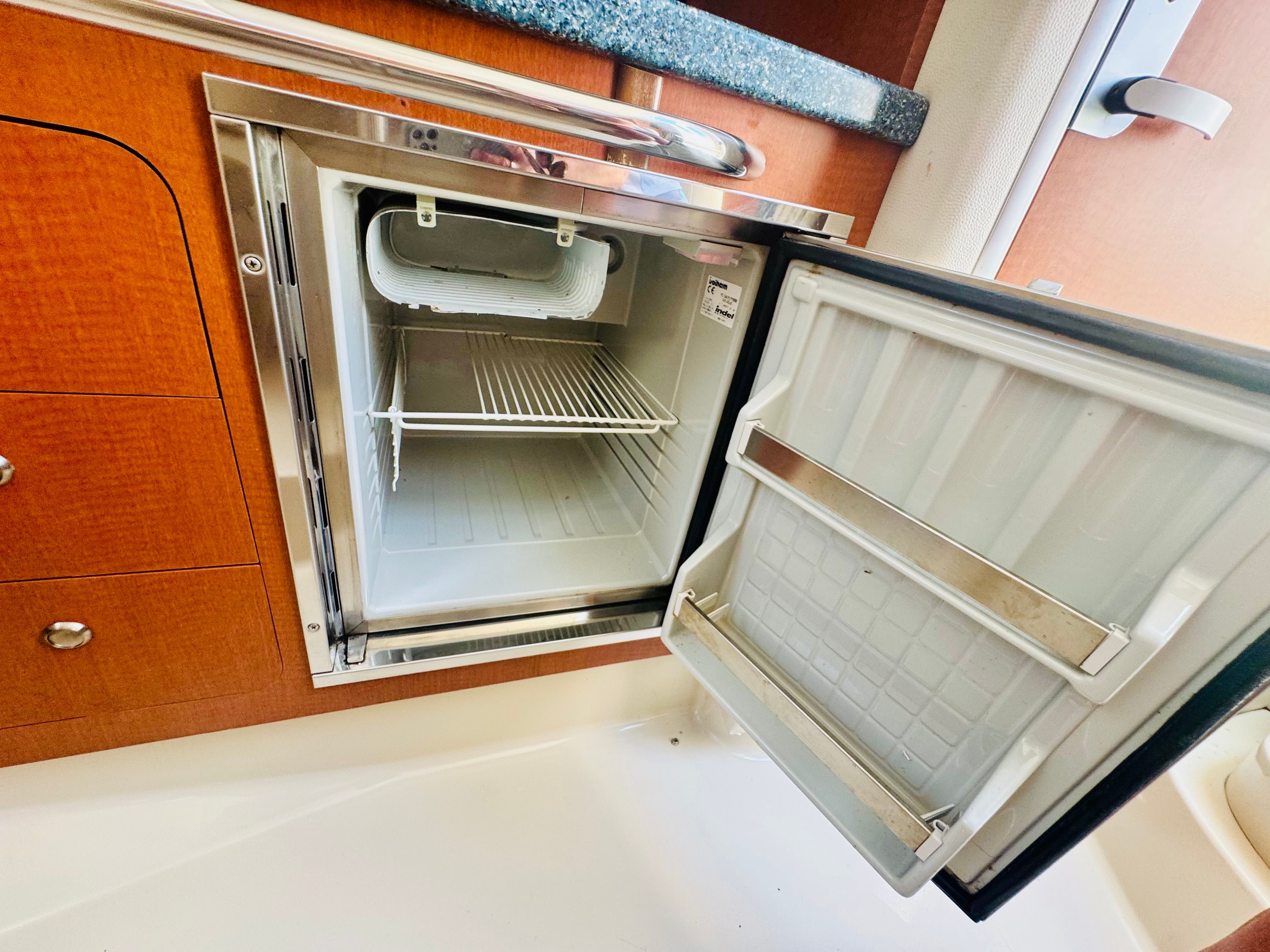 Open fridge in a 2005 Chaparral Signature 270 yacht.