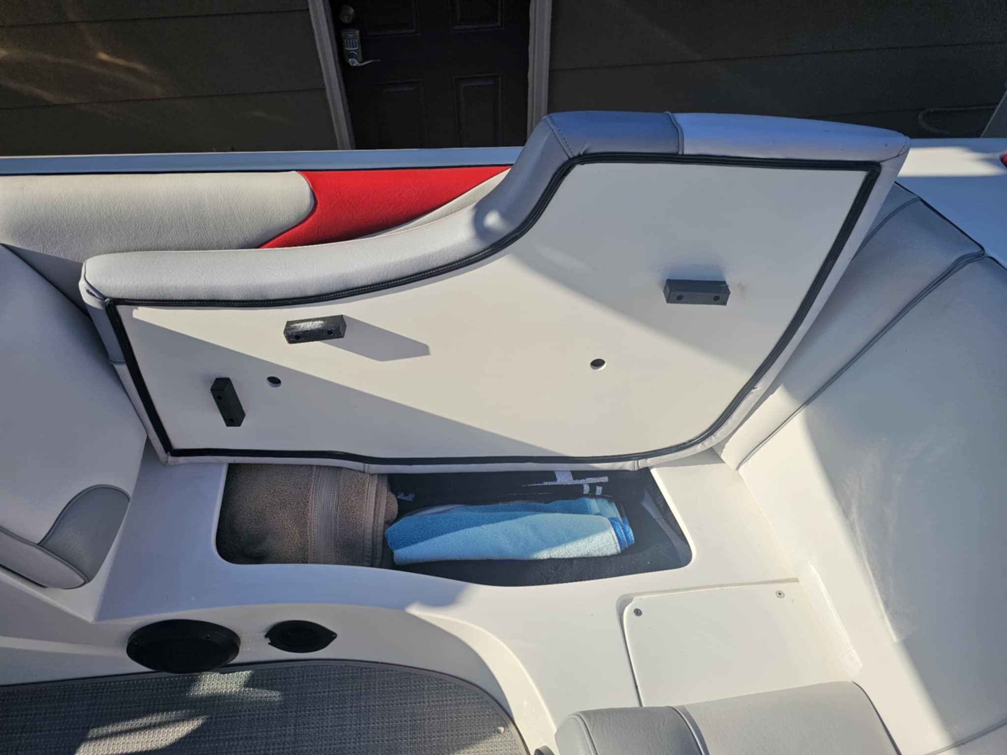 Interior of a 2006 MB PIGPR boat with storage compartment.