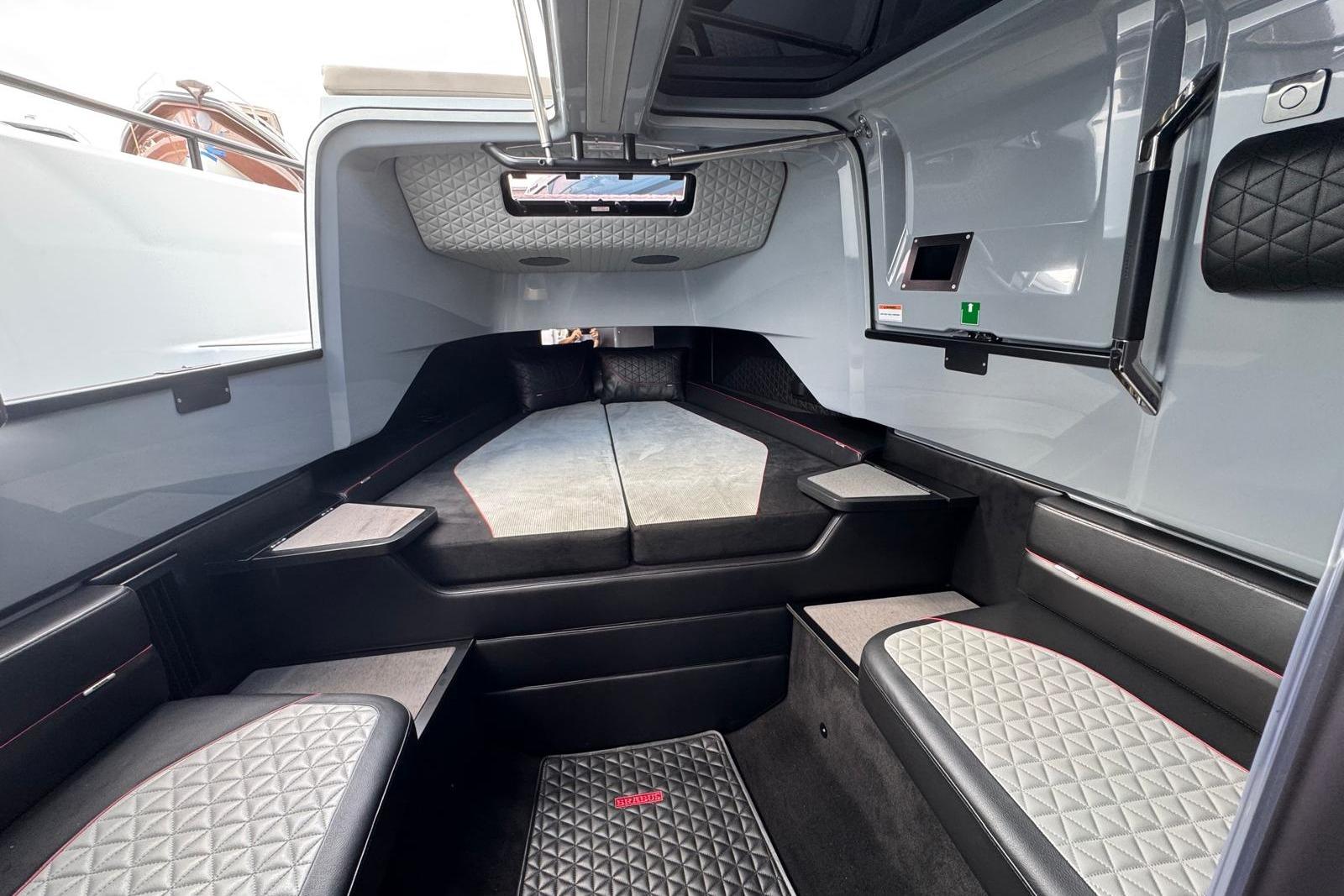 Luxurious interior of 2023 BRABUS Shadow 900 ST boat with quilted seating and modern design.