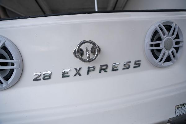 2016 Regal 28 Express boat rear view with speakers and logo.