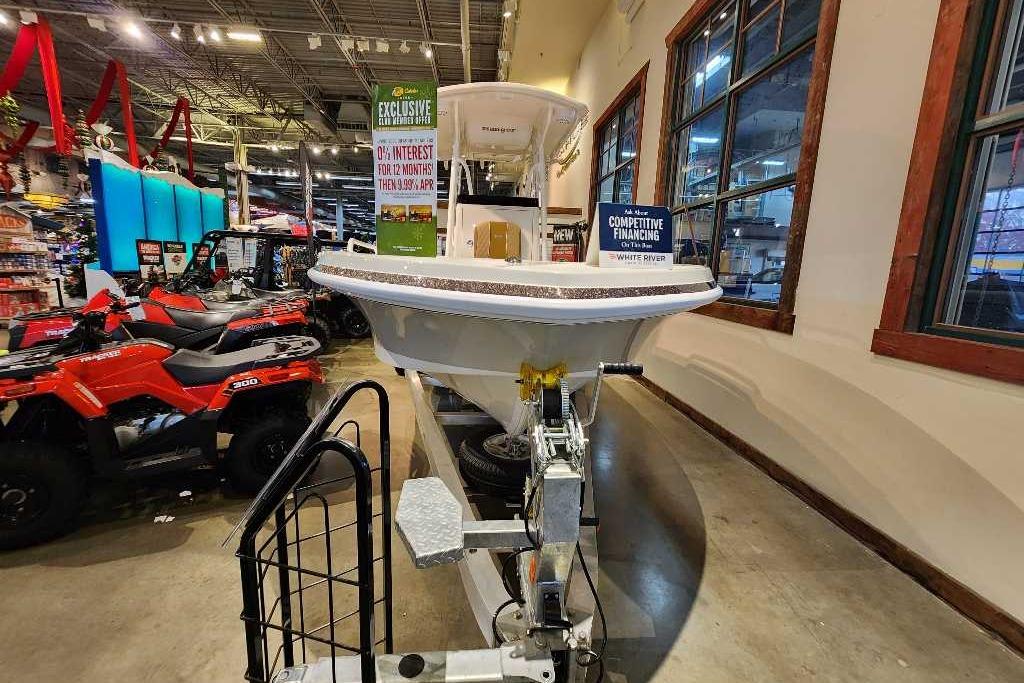 2025 Ranger 2360 Bay boat displayed indoors with financing offers.