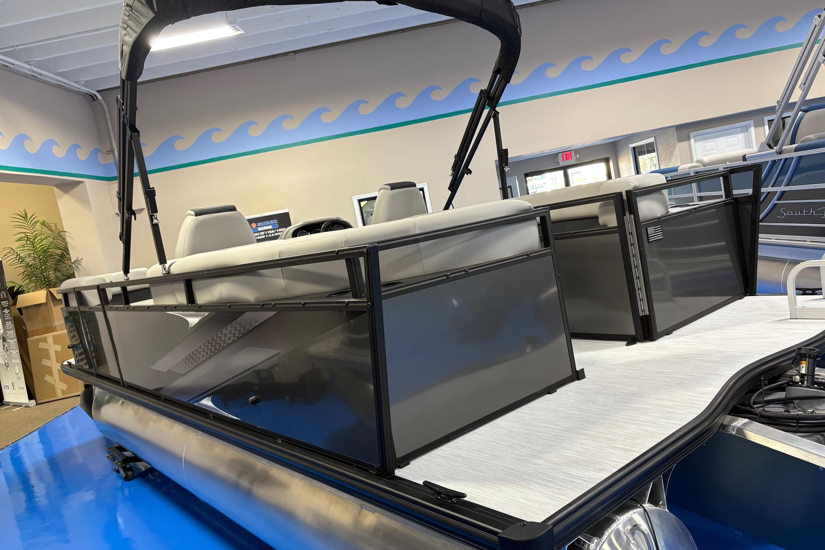 2026 Dockside 22DQ pontoon boat with sleek design in showroom setting.