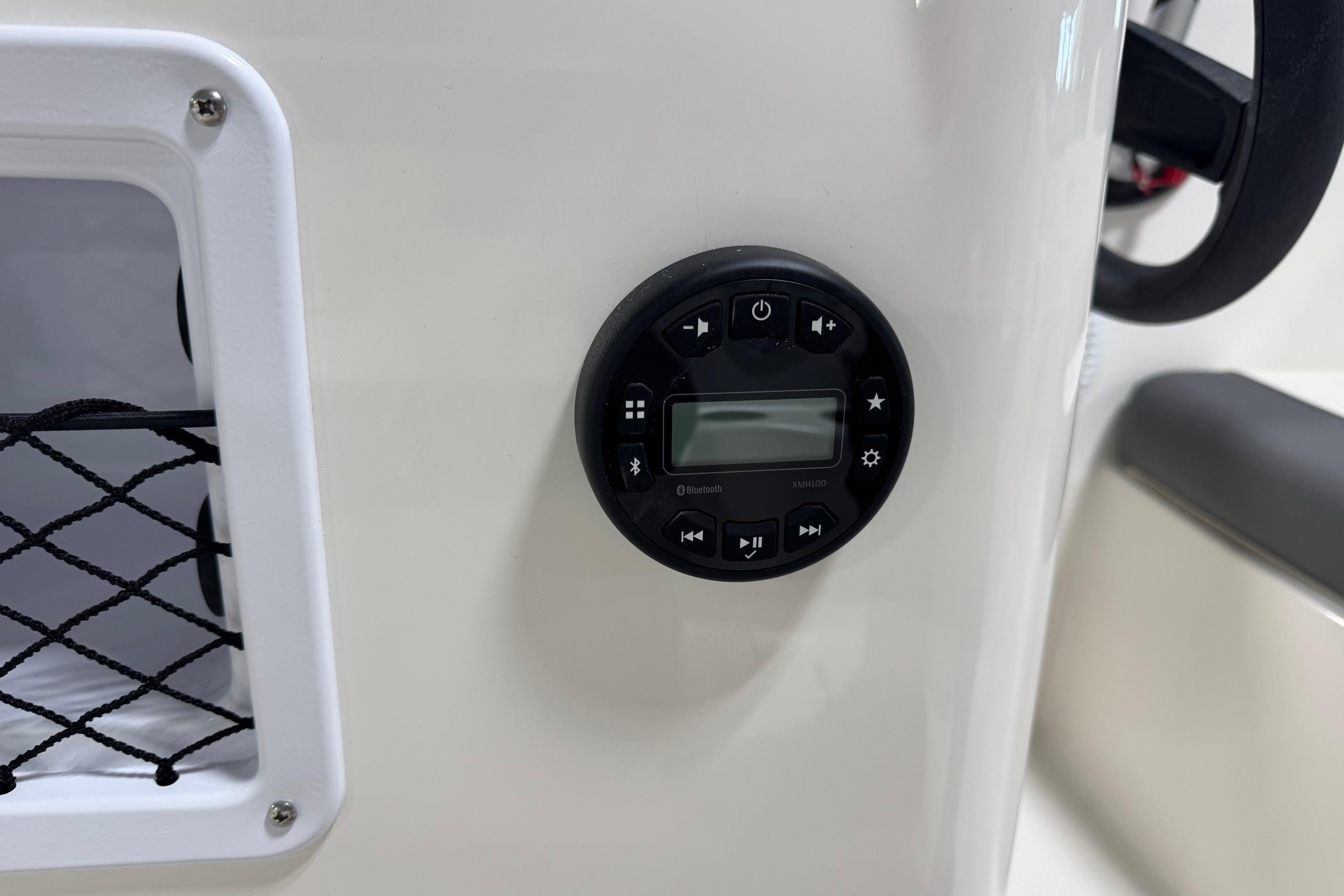 2026 Bayliner Element E18 boat dashboard with Bluetooth audio control panel.