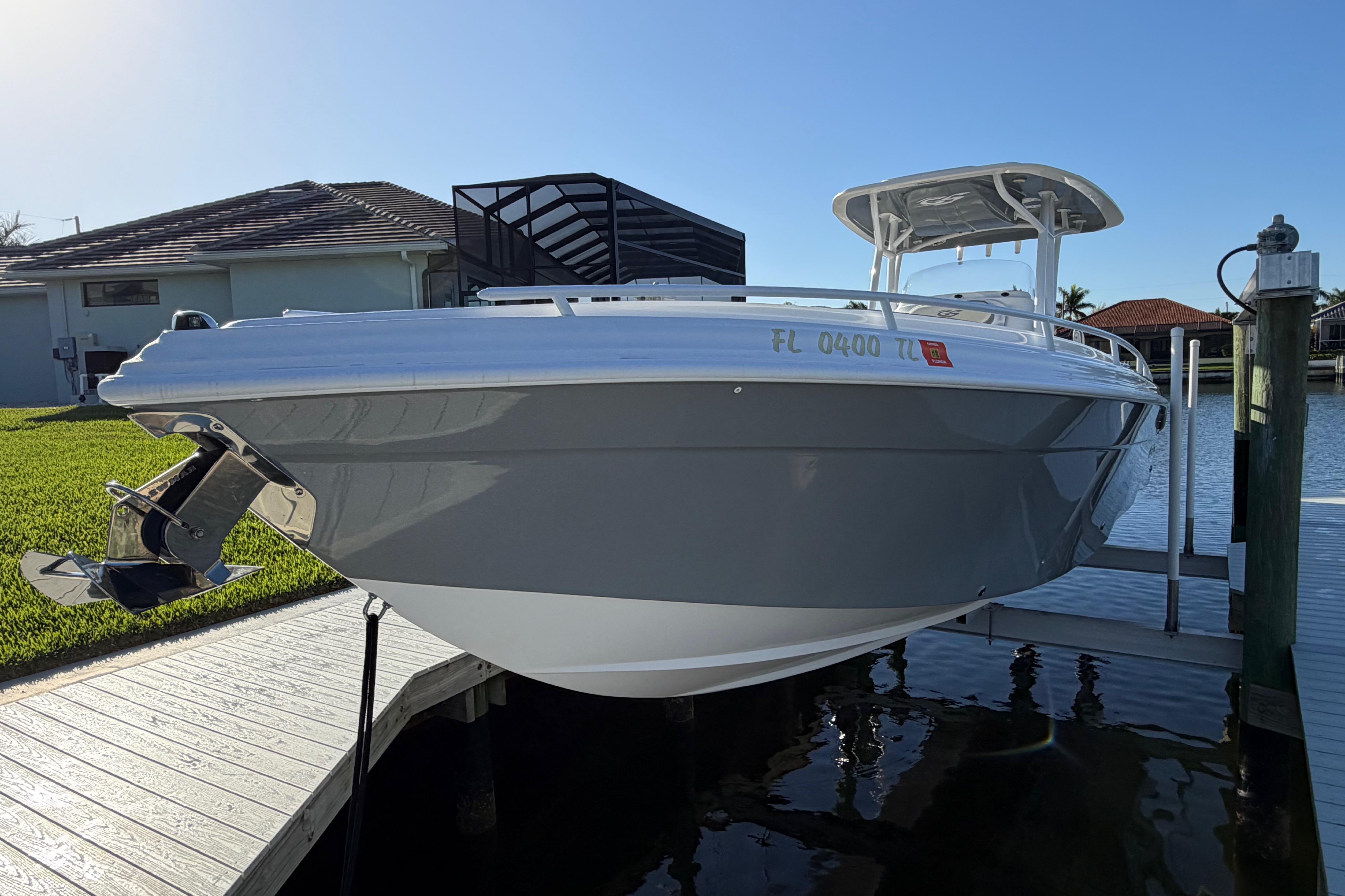 2022 Glasstream 328 Pro-XS boat docked, showcasing sleek design and modern features.