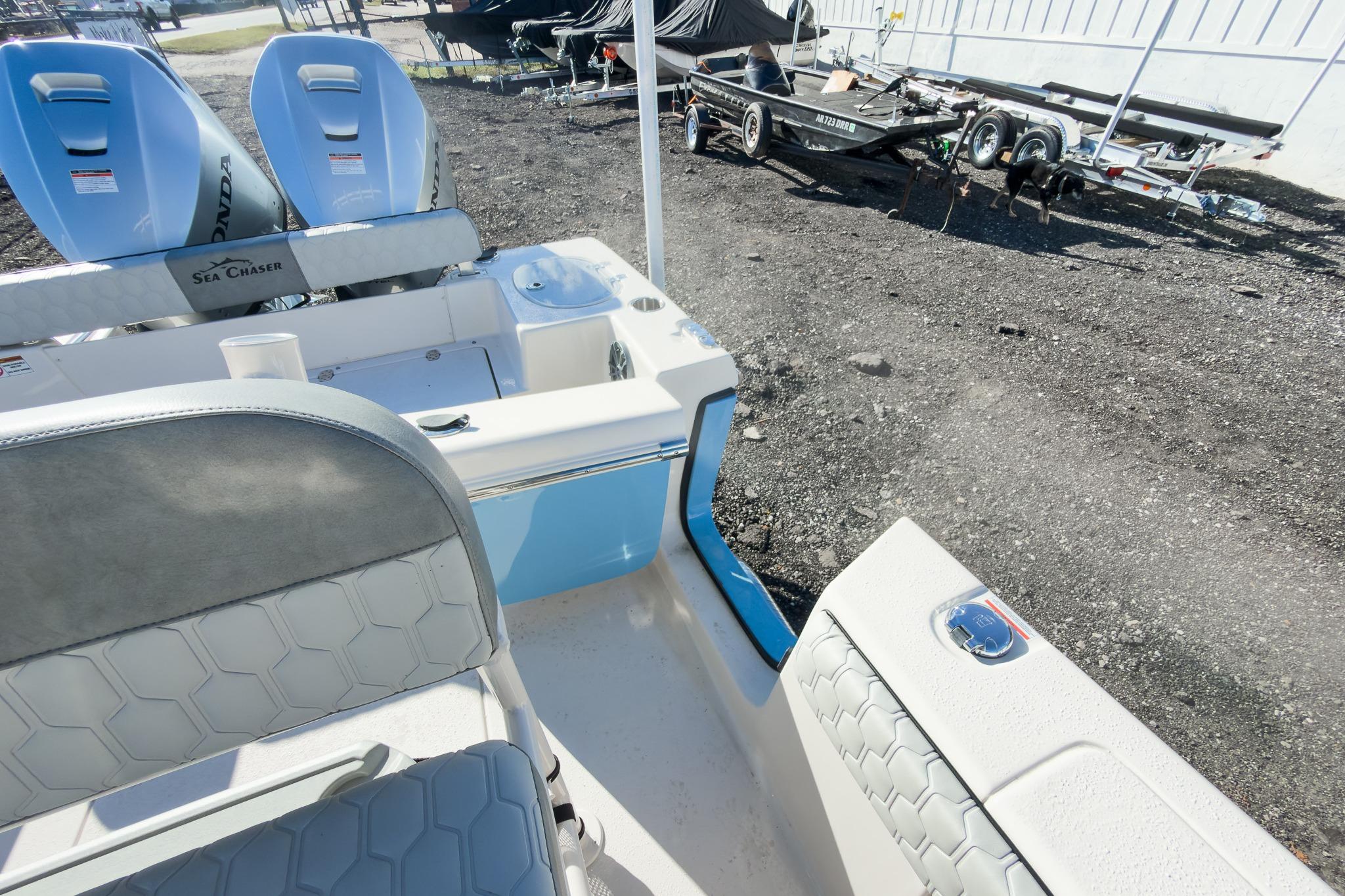 2026 Sea Chaser 24 HFC DE boat interior with seating and dual Honda engines.