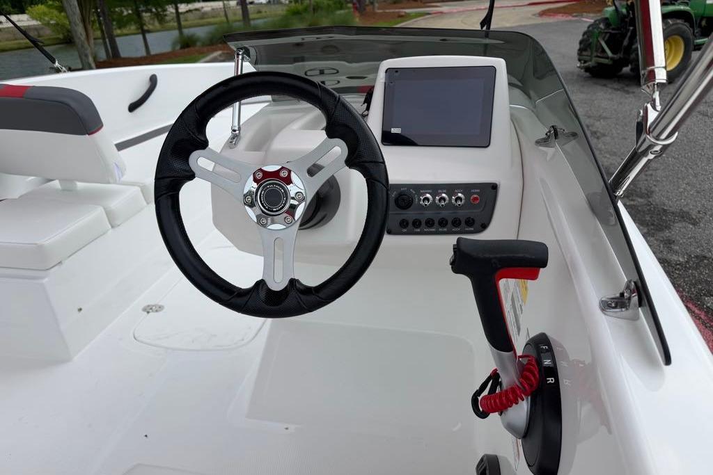 Steering console of 2026 Tahoe T16 boat with modern controls and touchscreen display.