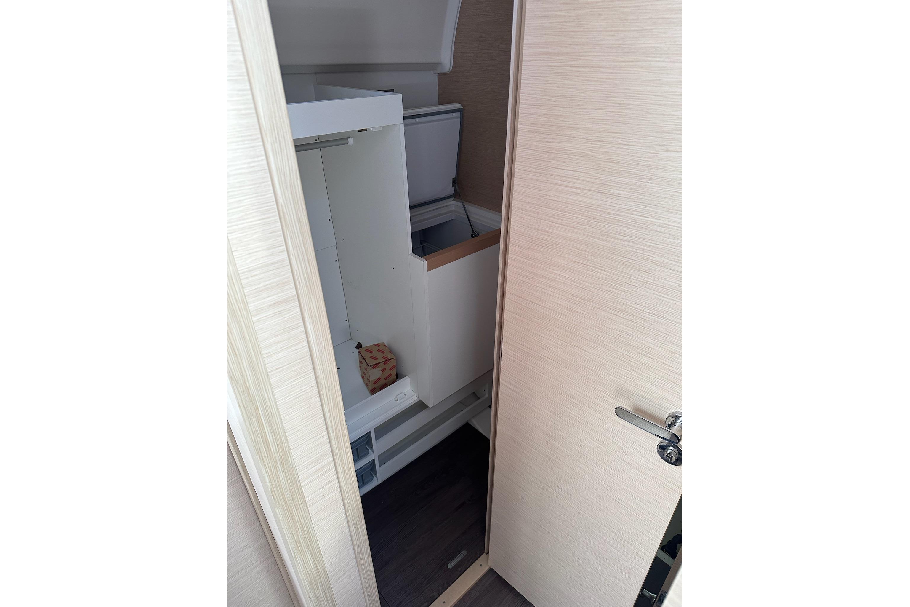 Interior storage space on a 2018 Jeanneau 51 yacht, featuring modern cabinetry.