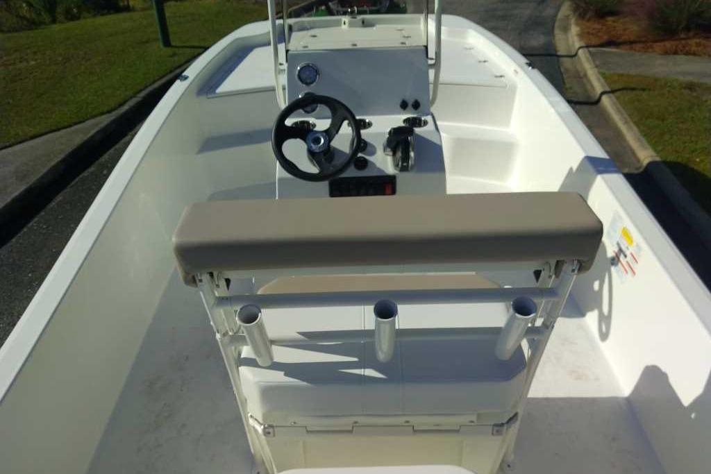 2026 Mako Pro Skiff 19 CC boat interior with steering console and seating.