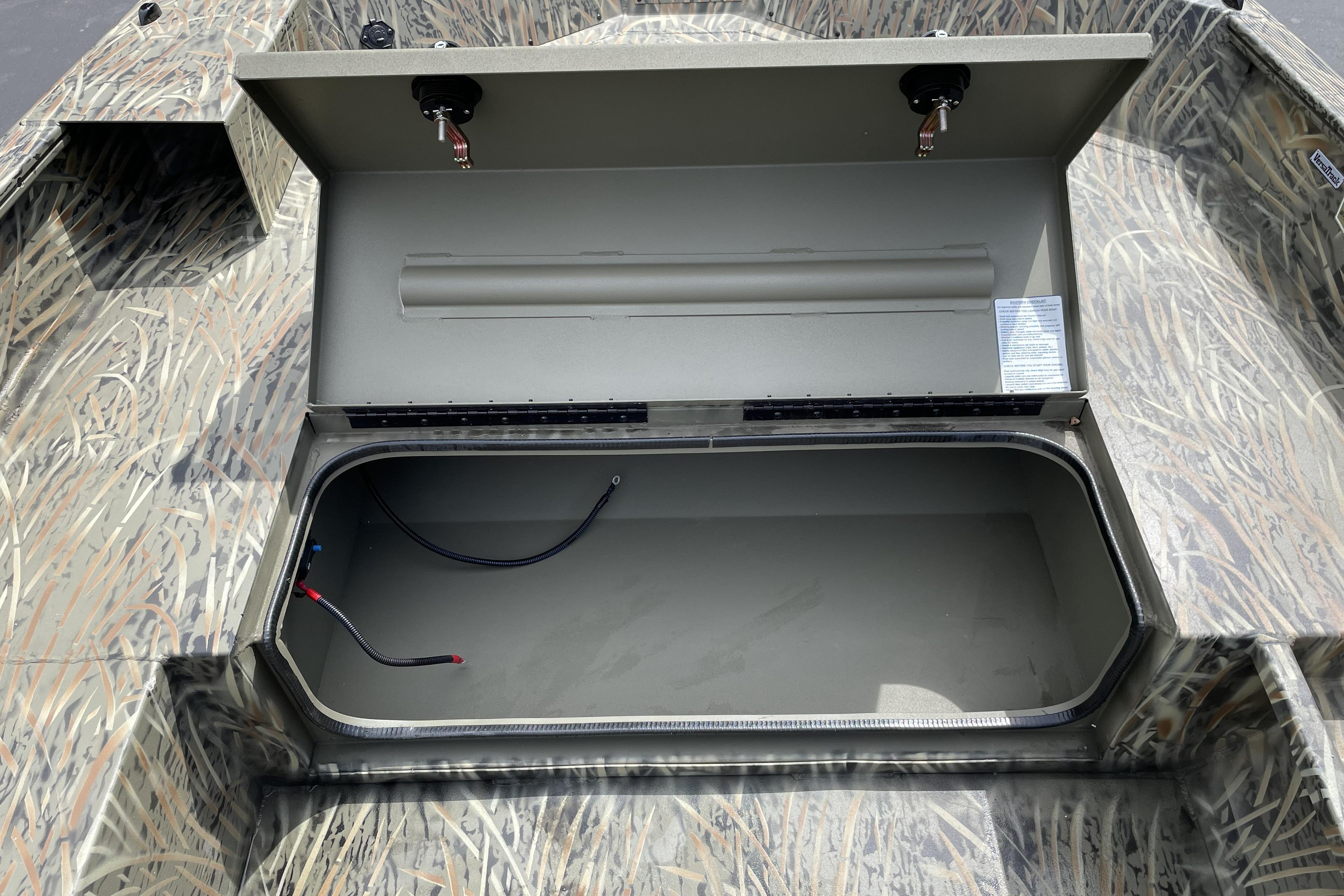 Open storage compartment in 2026 Tracker Grizzly 1756 T Marsh boat.