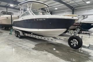 2022 Robalo R247 Dual Console boat on trailer in indoor storage facility.