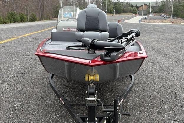 2026 Tracker Bass Tracker Classic XL boat on trailer, parked on asphalt road.