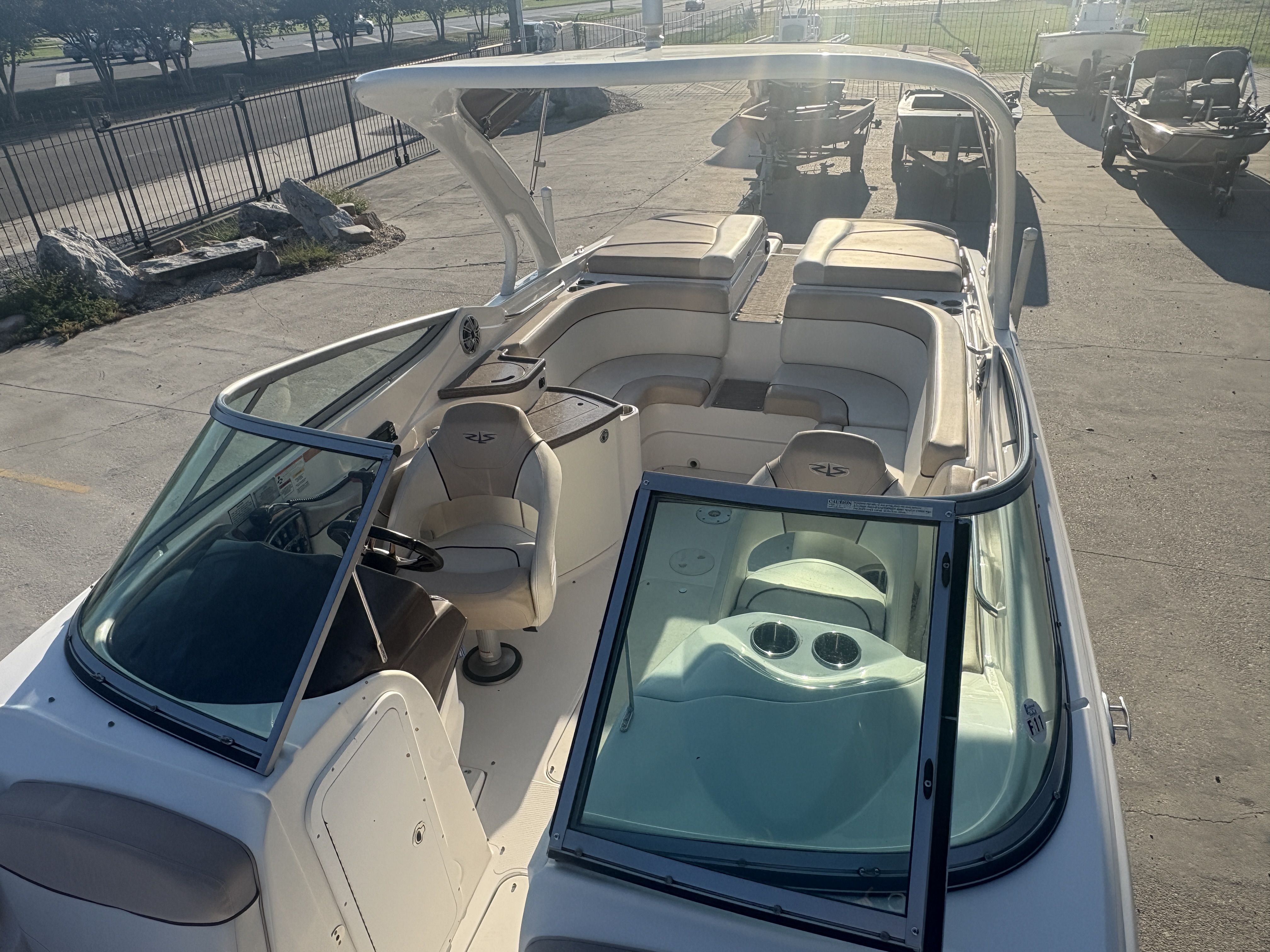 2013 Rinker Captiva 276 boat with spacious seating and sleek design.