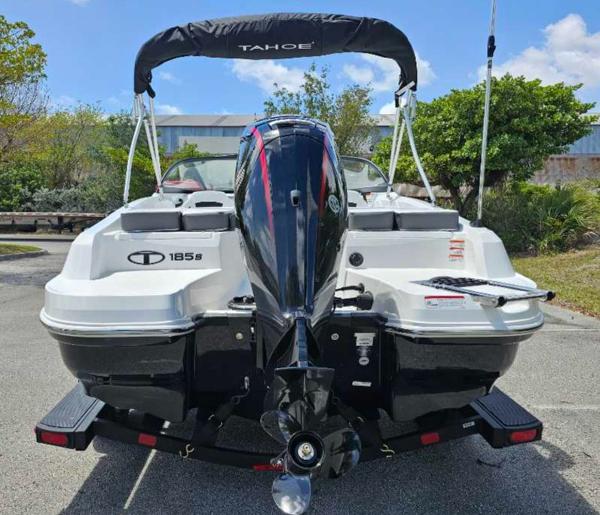 2025 Tahoe 185 S boat, rear view, parked outdoors on a sunny day.