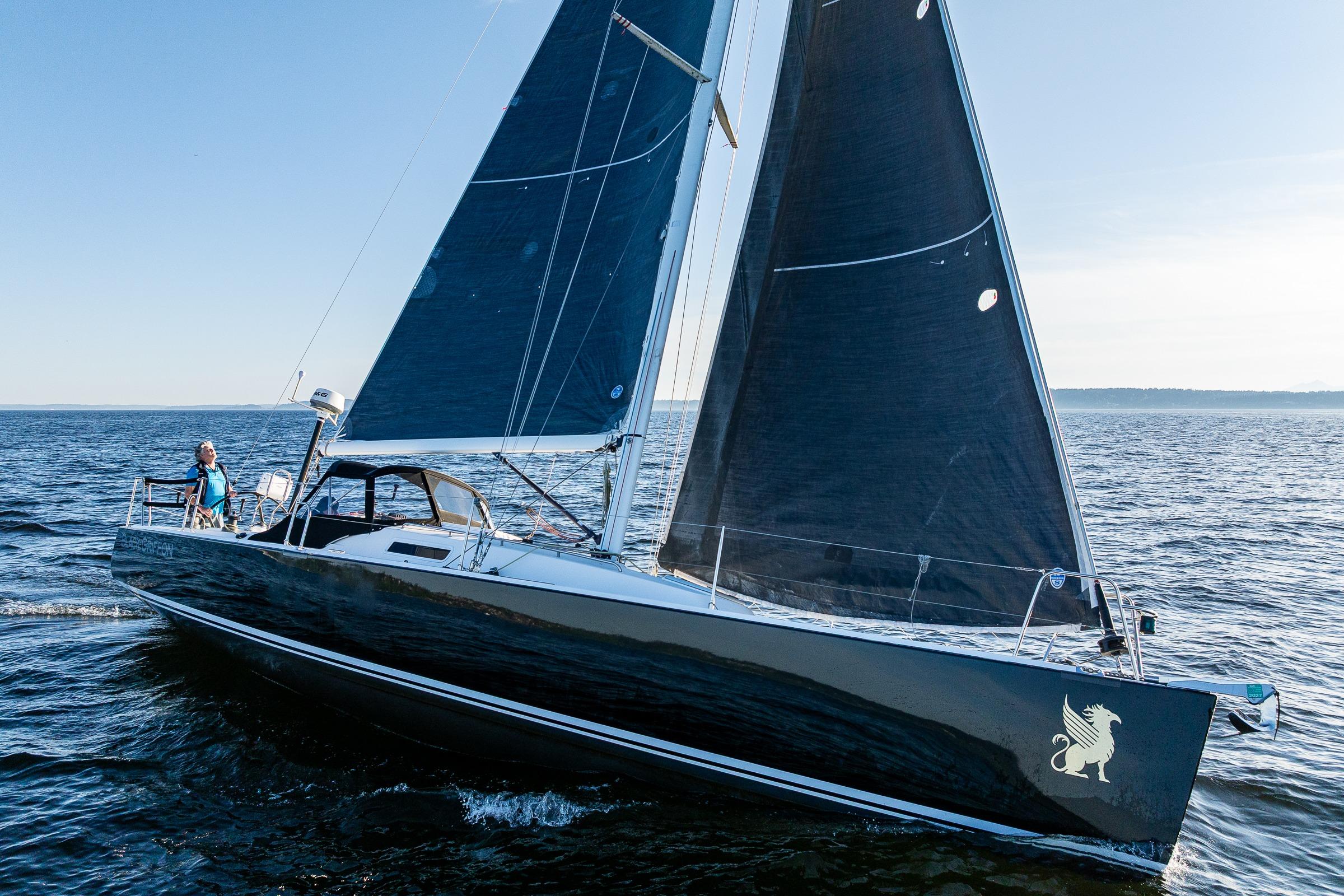 2007 J Boats J/124 sailing on open water with sleek design and dark sails.