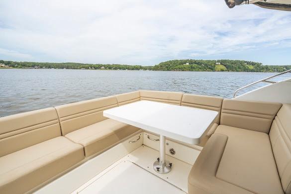 Luxurious seating area on 2016 Sea Ray Sundancer 510 yacht with scenic water view.