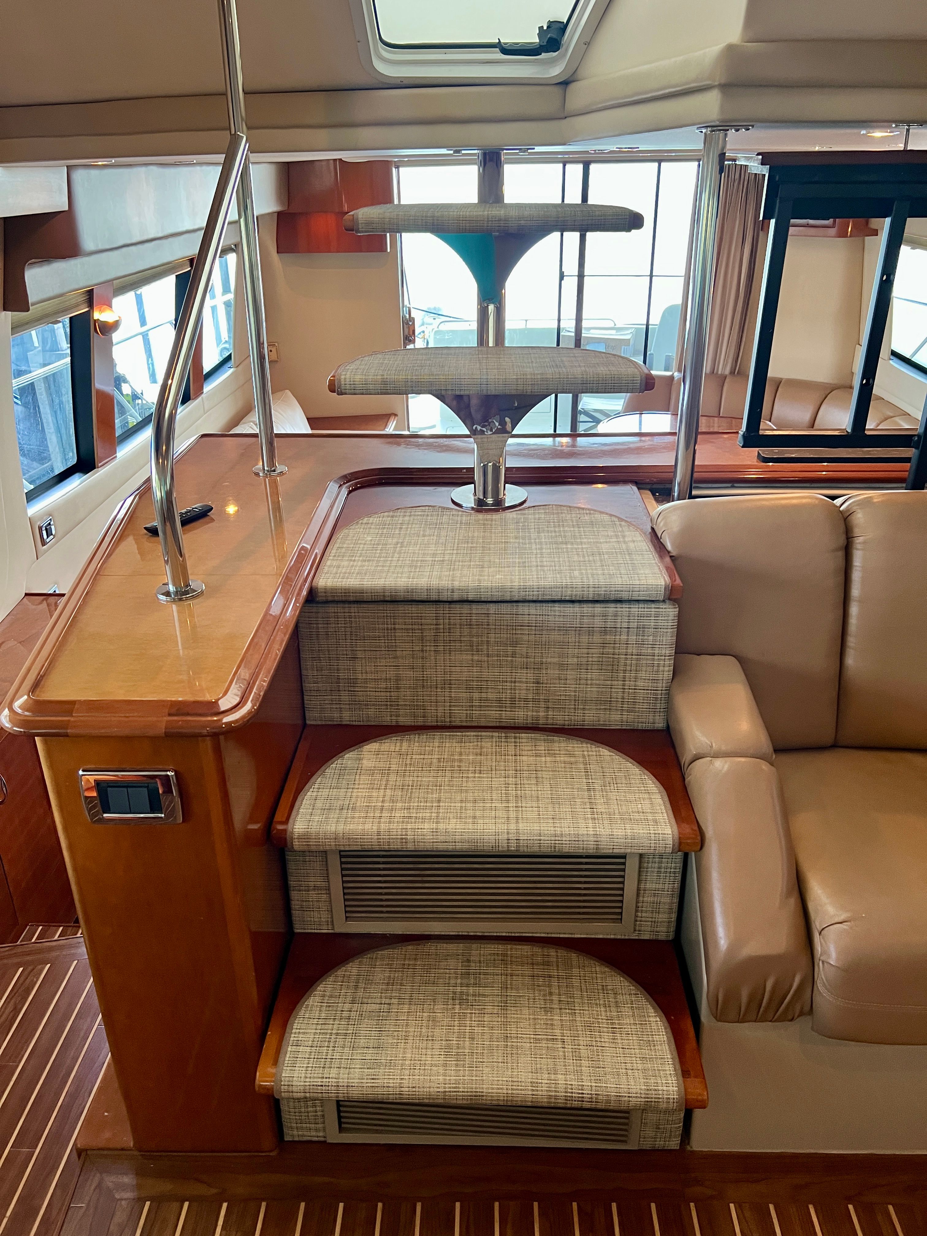 Interior of Carver 560 Voyager Sky yacht, stairs and sofa.