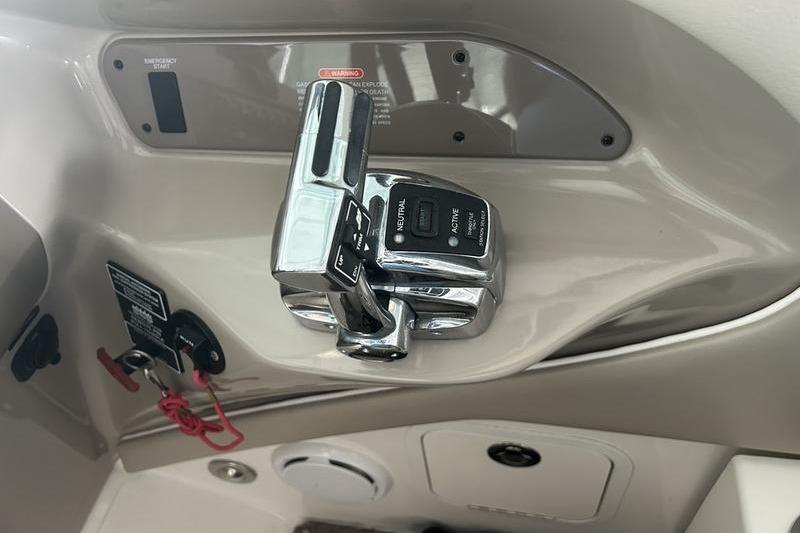 2011 Sea Ray 300 SLX boat throttle control panel with chrome finish.