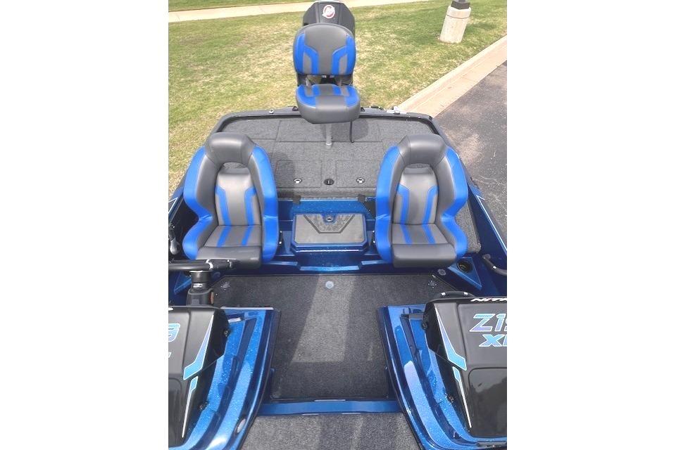 2026 Nitro Z19 XL boat interior with blue and gray seating, parked on grass.