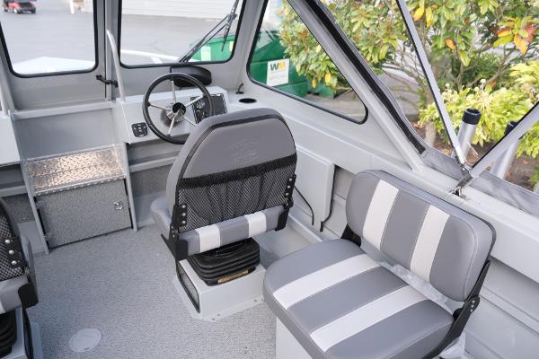 2024 Hewescraft 180 Pro-V ET boat interior with gray seating and steering wheel.