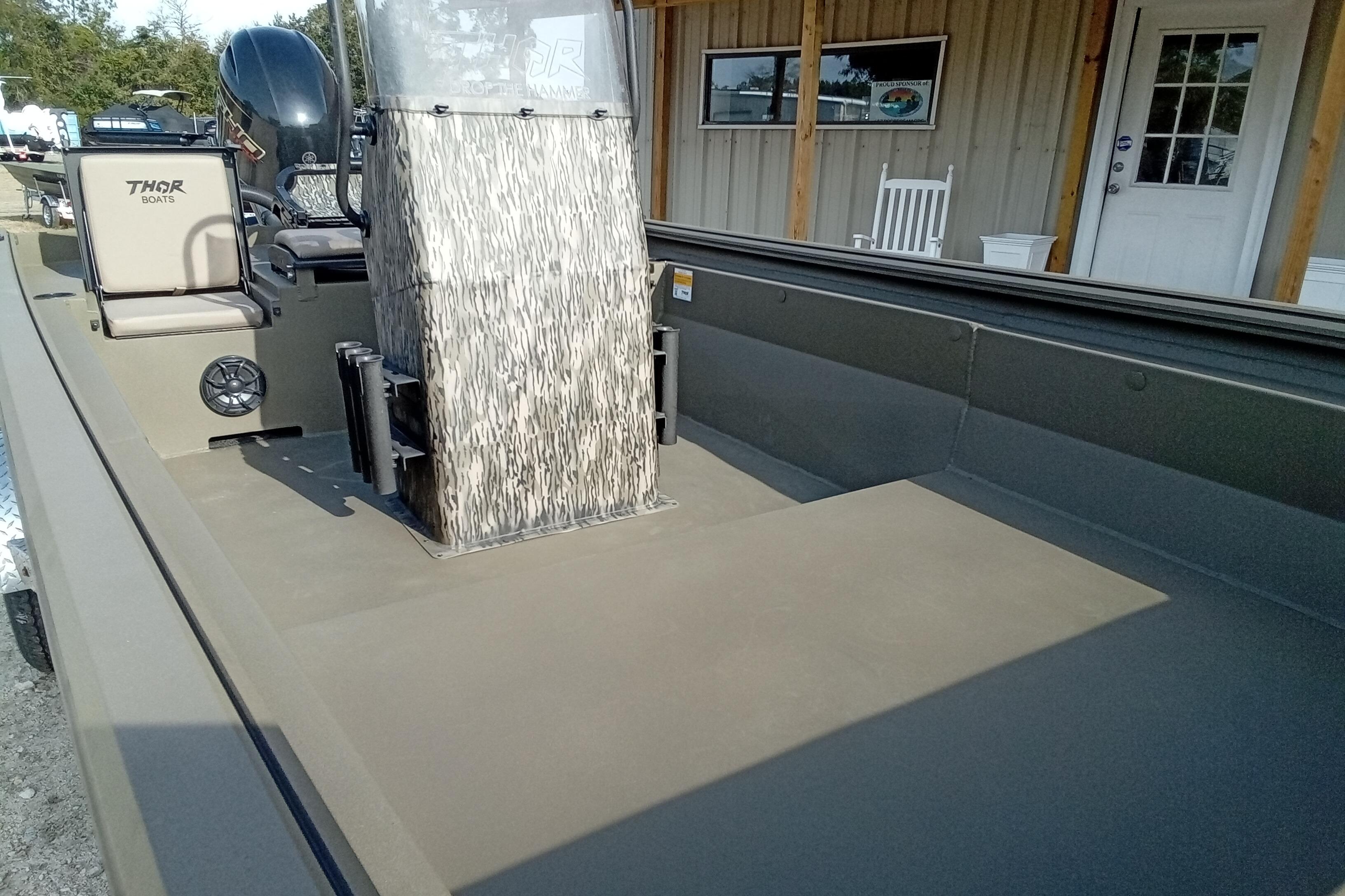 2026 Thor 1900 Low Country Elite boat with camouflage console and seating.