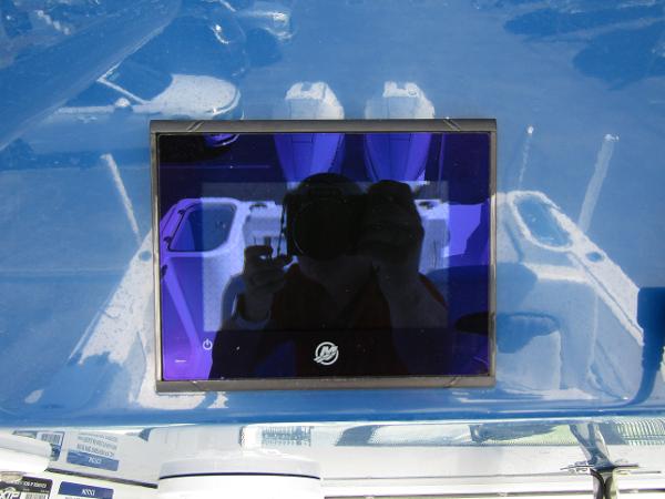2024 Wellcraft 263 Fisherman boat dashboard with reflective display screen.