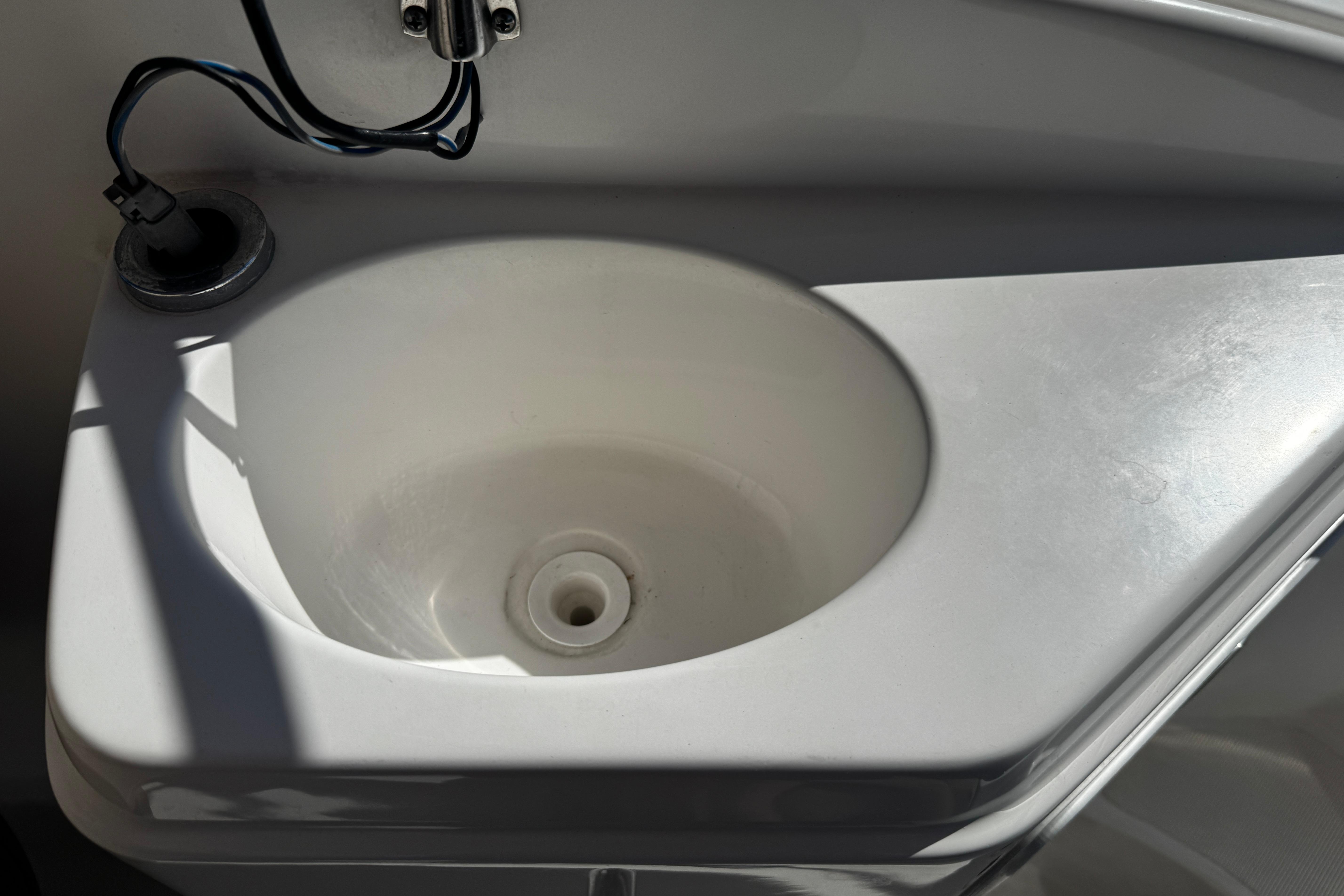 2021 Hurricane SunDeck 2200 DC OB boat sink with faucet and wiring.
