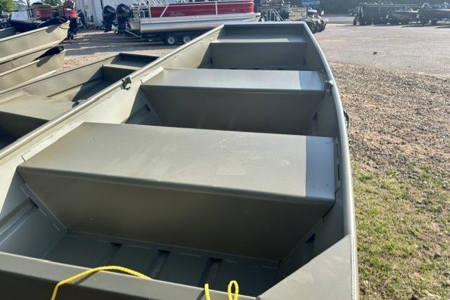 2026 Tracker Grizzly 10 Jon boat, olive green, parked on gravel lot.