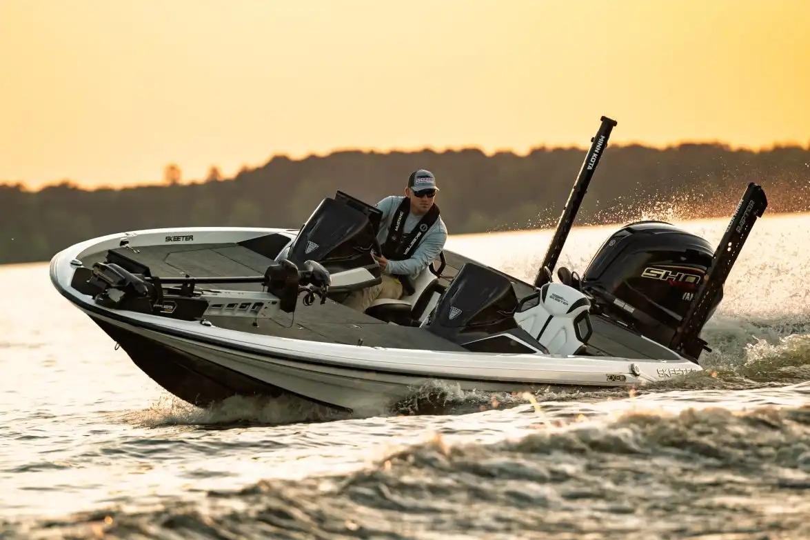 Manufacturer Provided Image: 2026 Skeeter ZXE21 boat cruising on a lake at sunset.