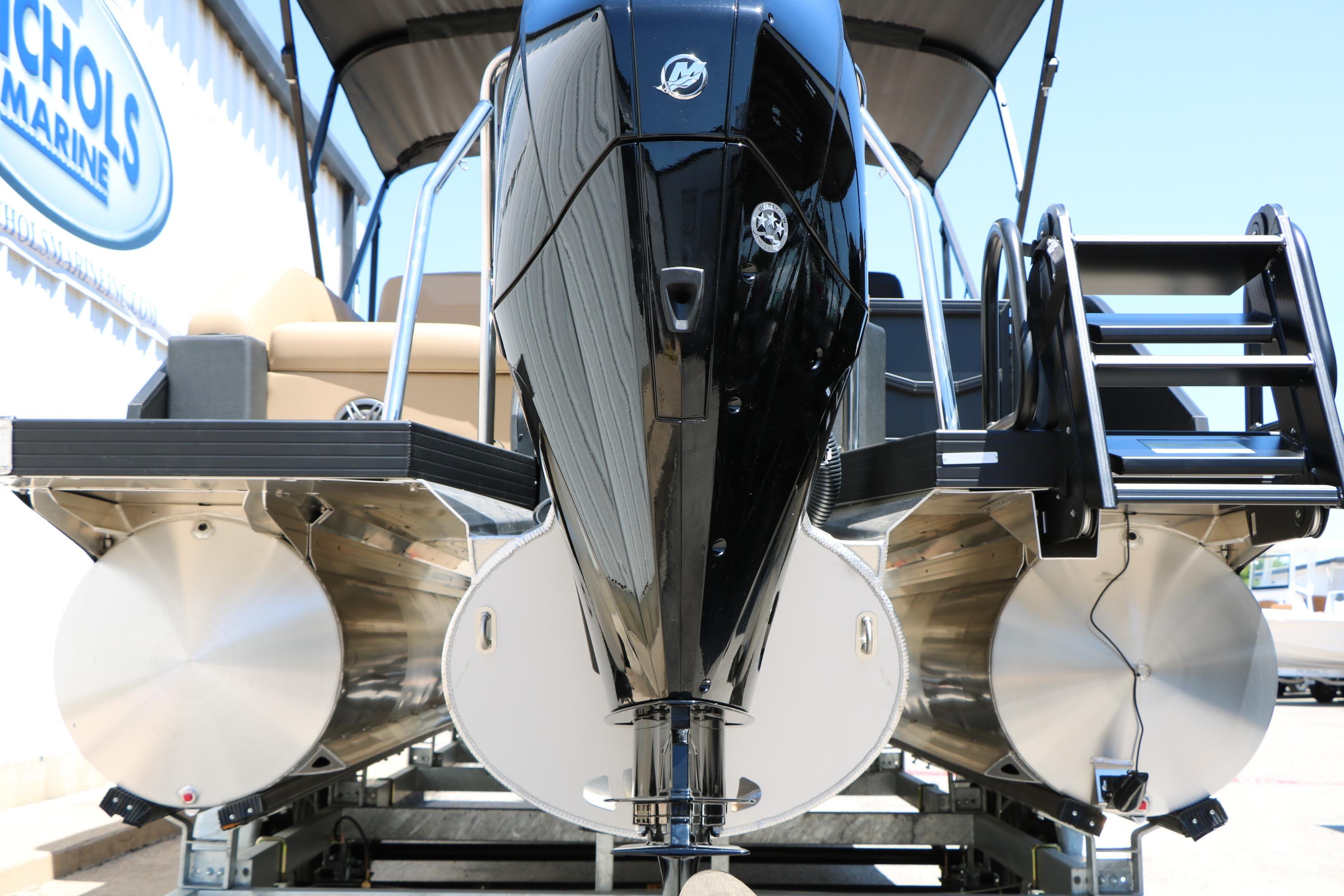 2026 Evotti 521CS pontoon boat with powerful outboard motor and sleek design.