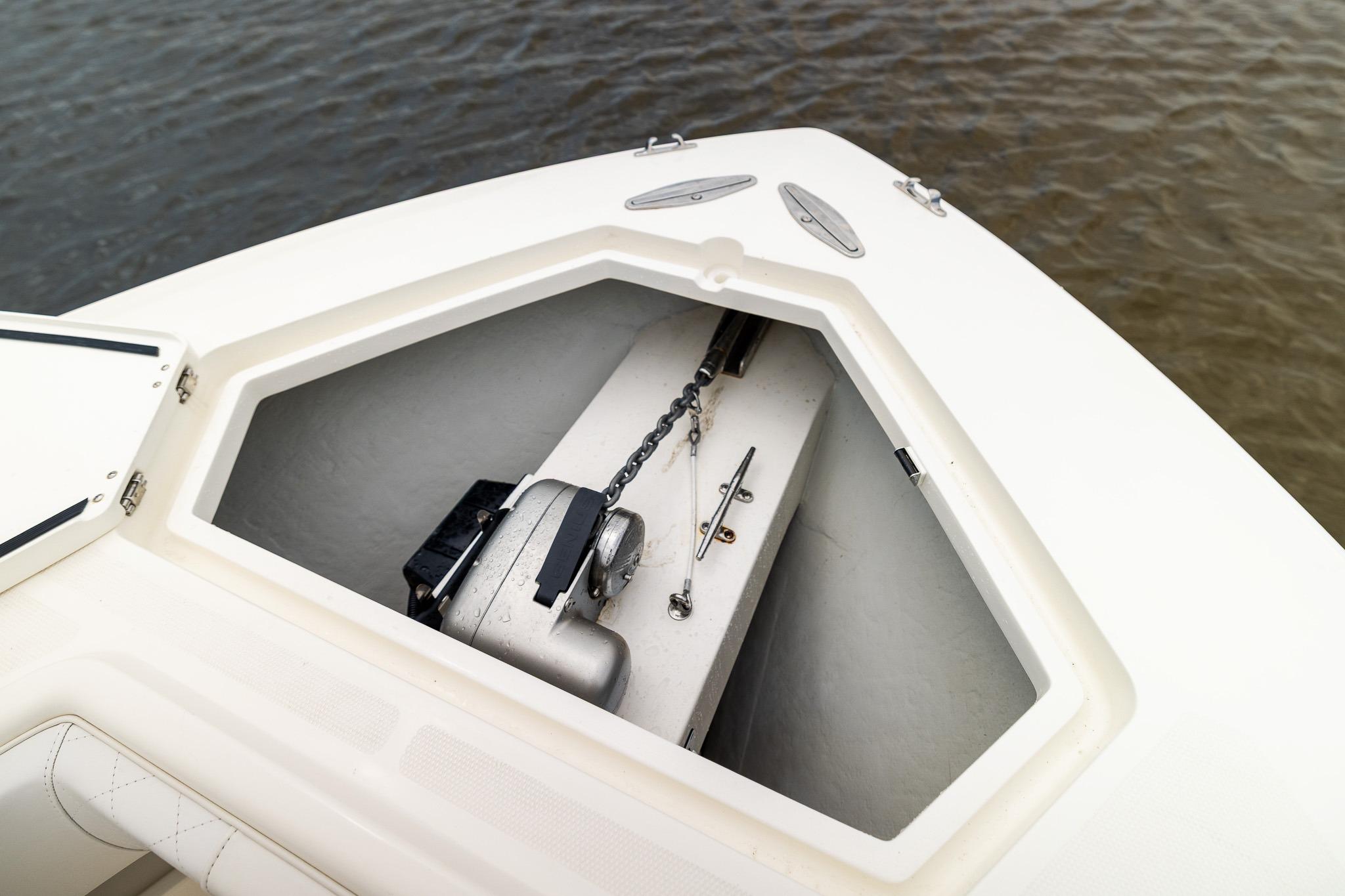 2019 SeaVee 322Z anchor compartment with chain and winch, near water.